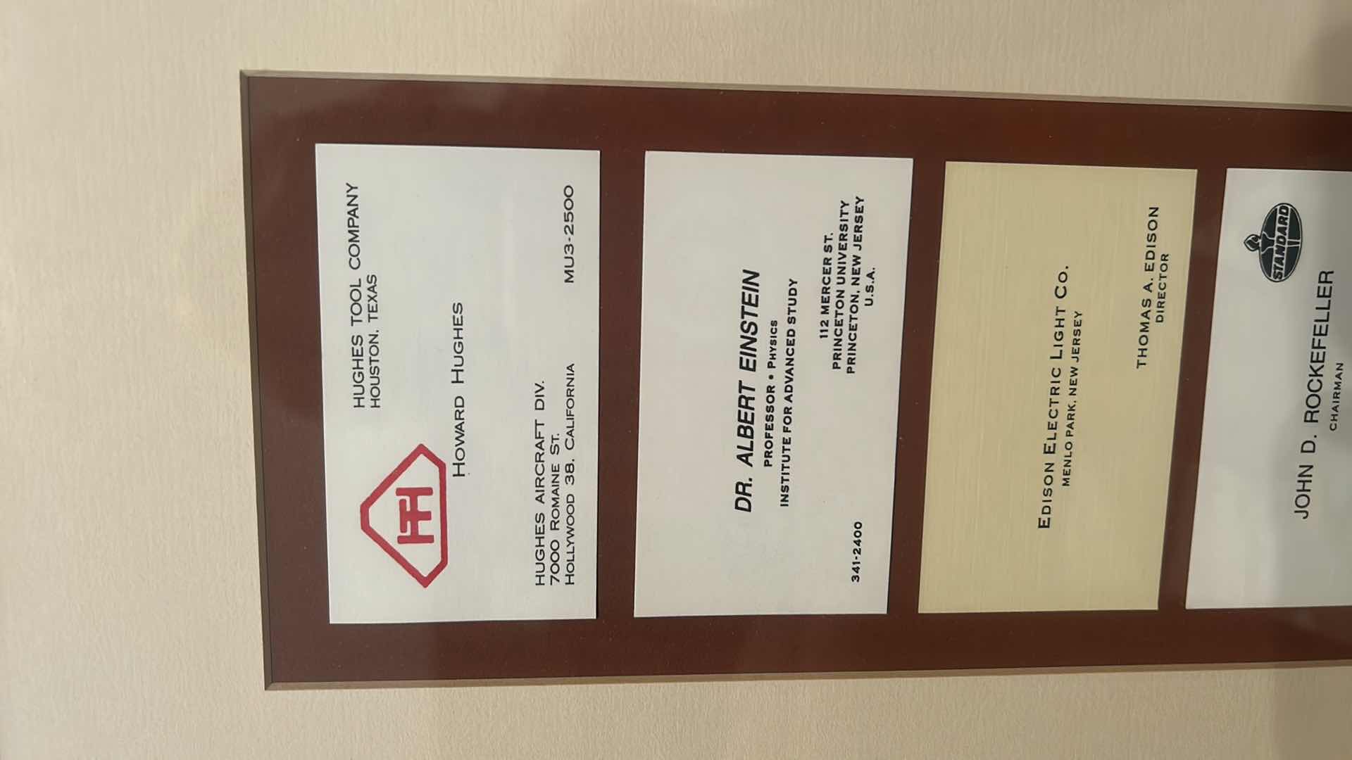 Photo 1 of COLLECTION OF VINTAGE RARE CALLING CARDS, INCLUDING MARGARET MEAD, ETHEL BARRYMORE, EMILY POST, ELEANOR ROOSEVELT, ALBERT EINSTEIN, JOHN D ROCKEFELLER AND MANY MORE, FRAMED ARTWORK eight and three-quarter inches by 30 inches