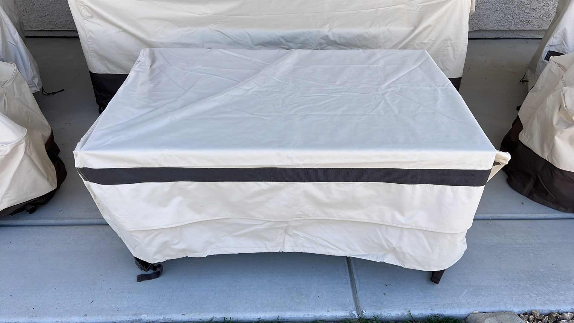 Photo 1 of SUNBRELLA WICKER W METAL PATIO TABLE & PROTECTIVE COVER 44” x 28” H22”