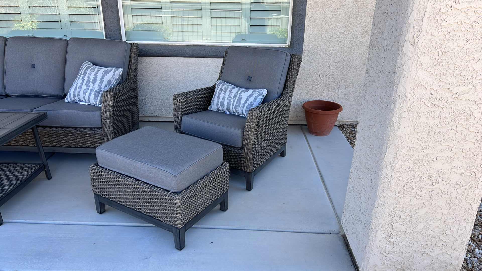 Photo 1 of SUNBRELLA WICKER PATIO CHAIR W OTTOMAN & PROTECTIVE COVER