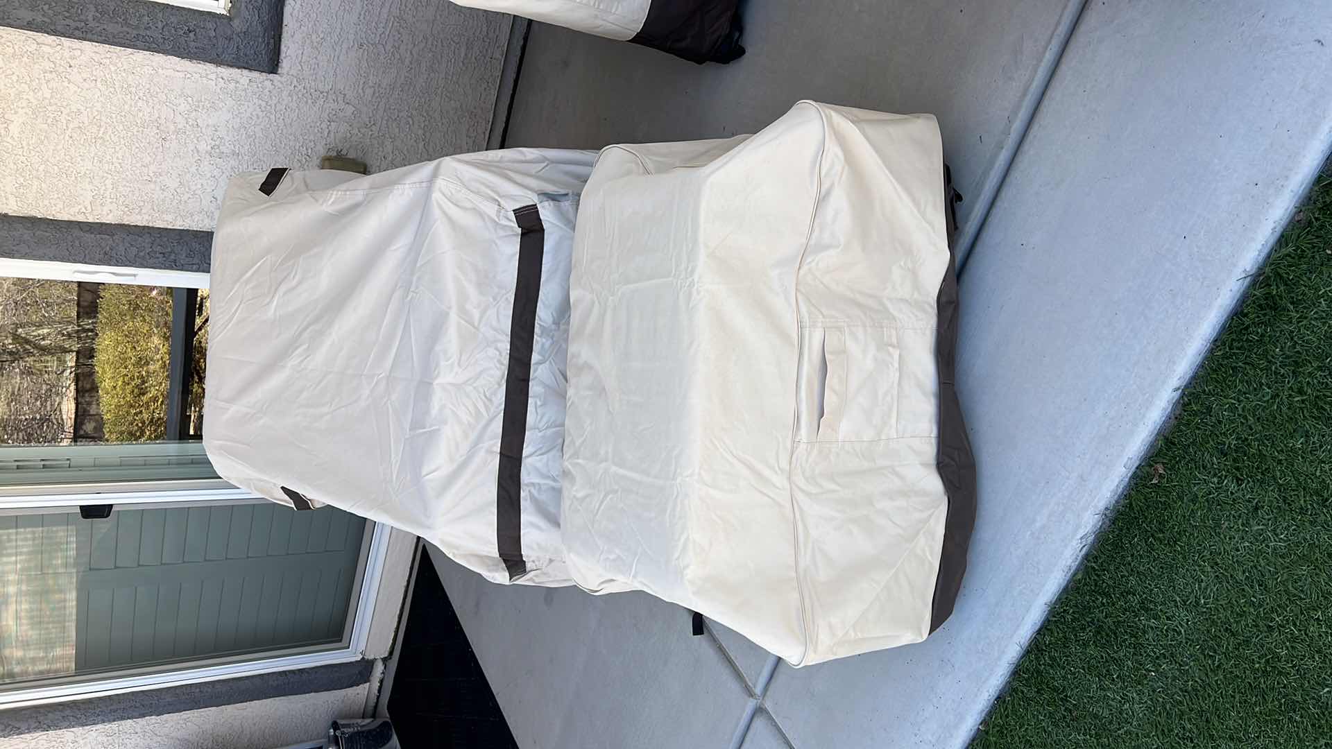 Photo 1 of SUNBRELLA WICKER PATIO CHAIR W OTTOMAN & PROTECTIVE COVER