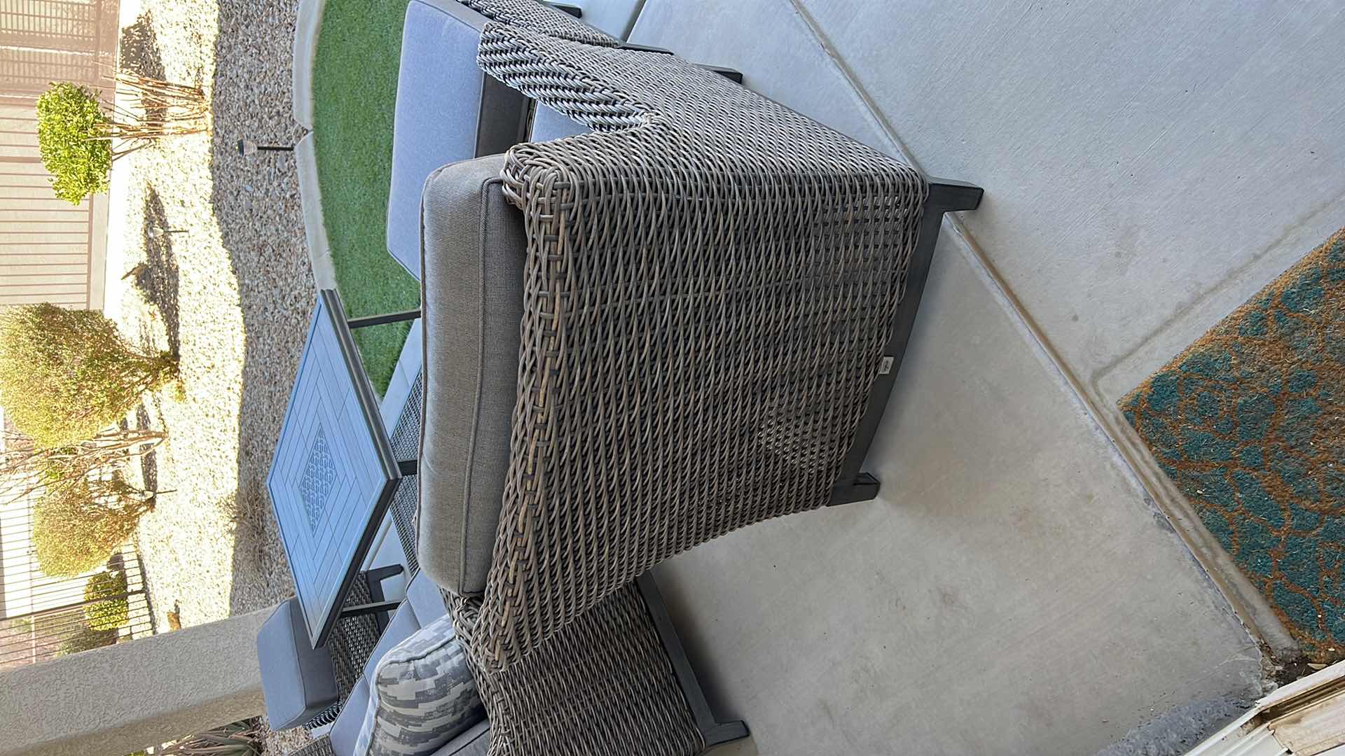 Photo 1 of SUNBRELLA WICKER PATIO CHAIR W OTTOMAN & PROTECTIVE COVER