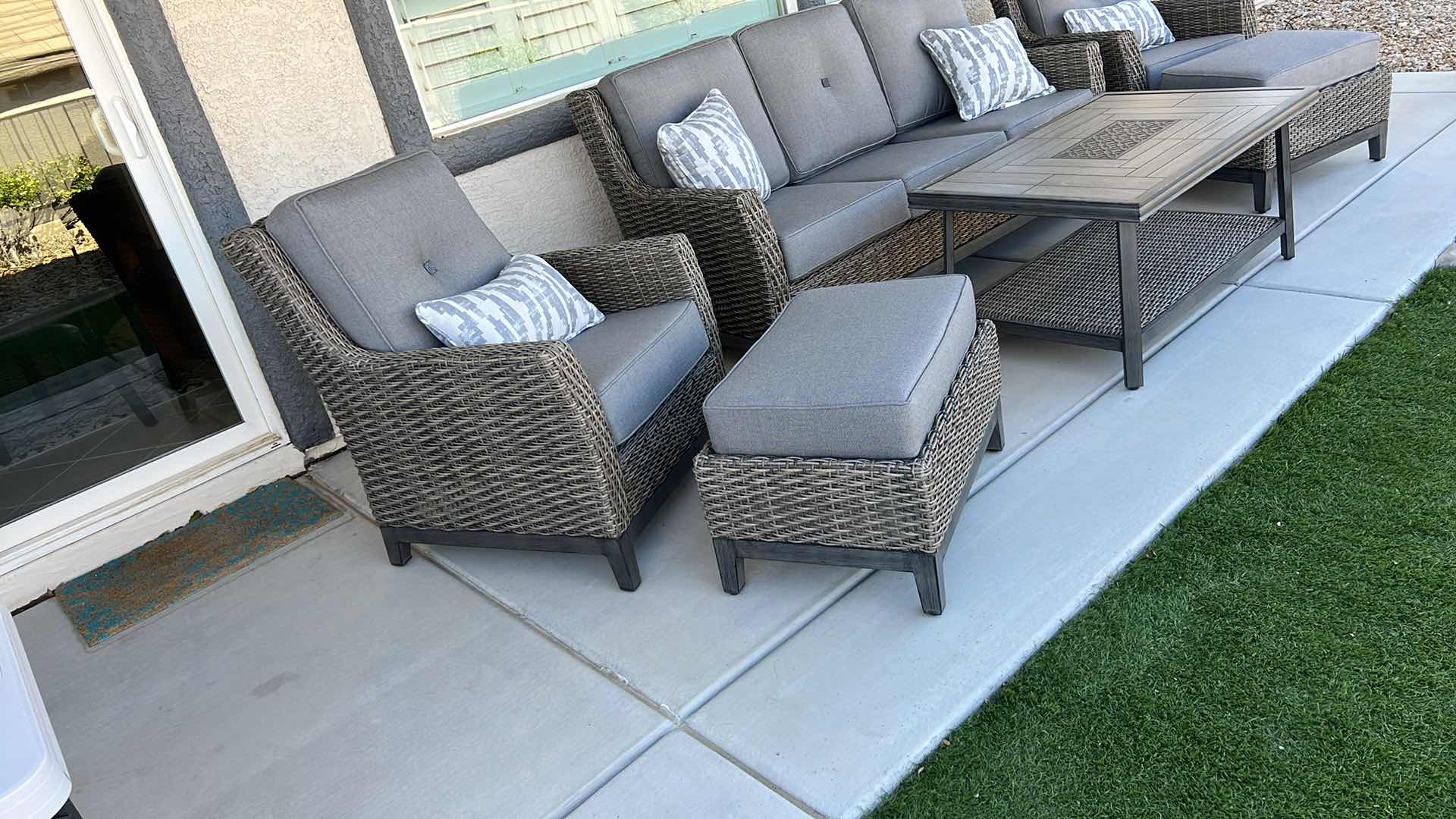 Photo 1 of SUNBRELLA WICKER PATIO CHAIR W OTTOMAN & PROTECTIVE COVER