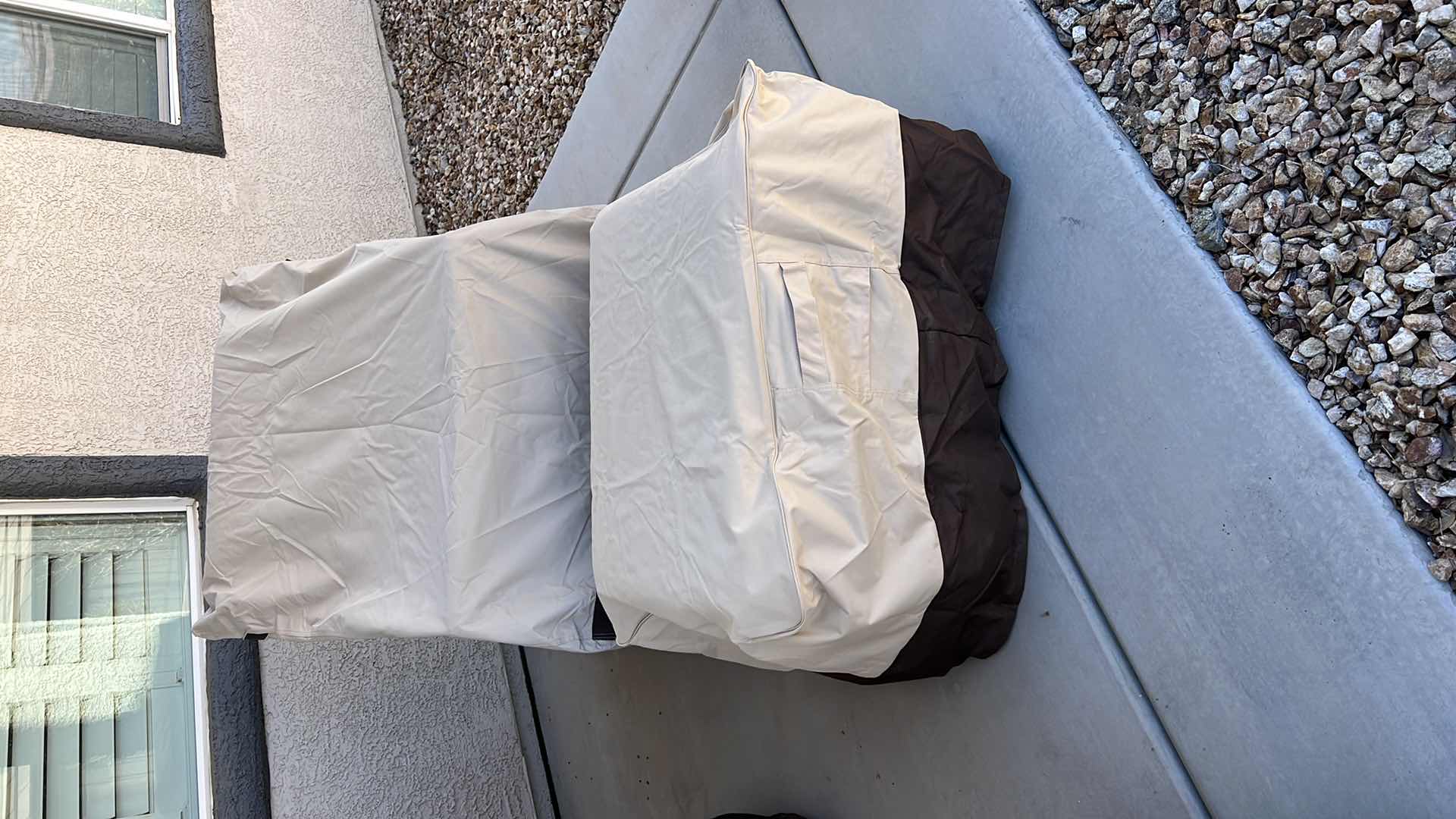 Photo 1 of SUNBRELLA WICKER PATIO CHAIR W OTTOMAN & PROTECTIVE COVER