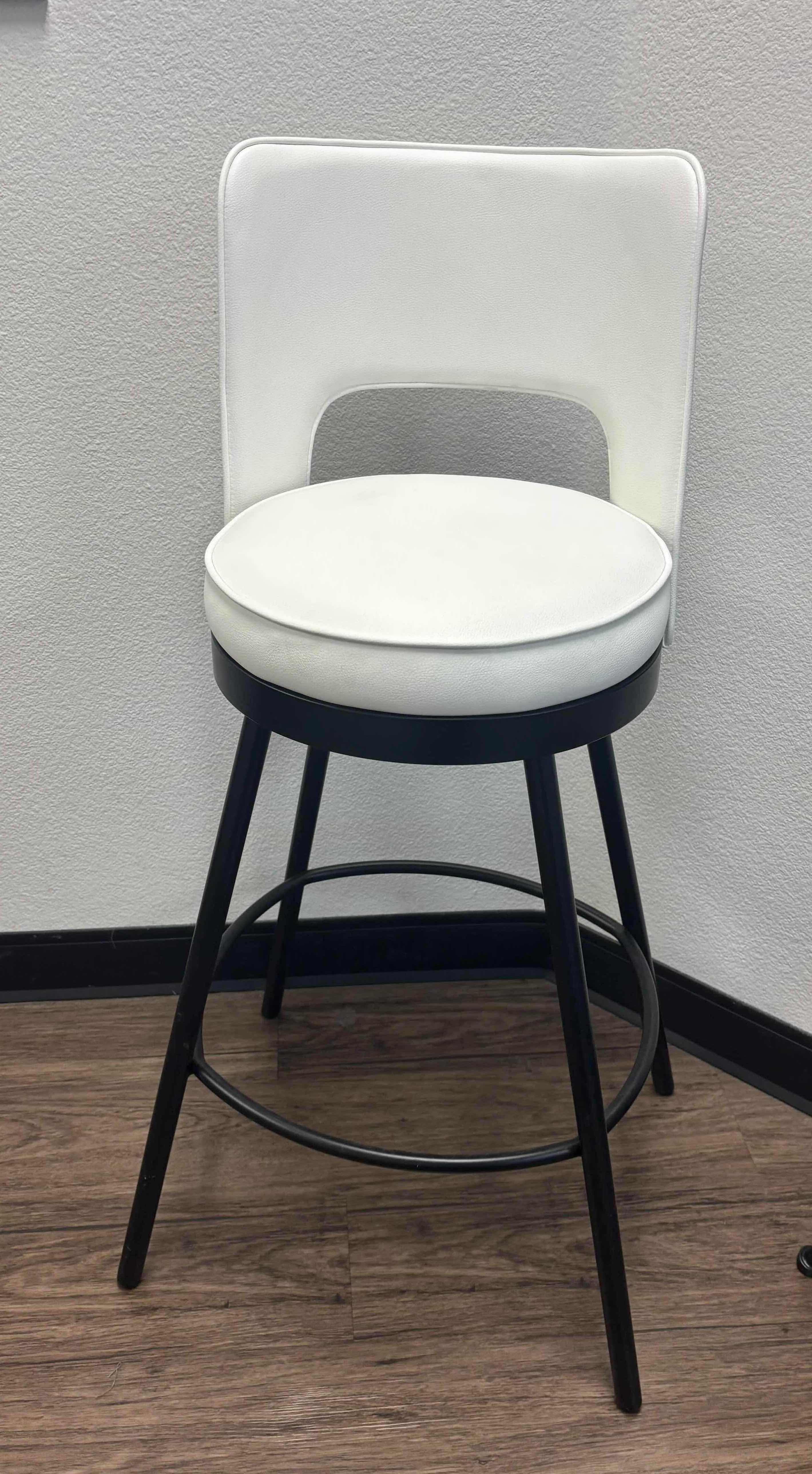 Photo 1 of VILLAGE CASA WHITE LEATHER SWIVEL BAR CHAIR W POWDER COATED BLACK LEGS (17” W x 21” D x 41” H). 