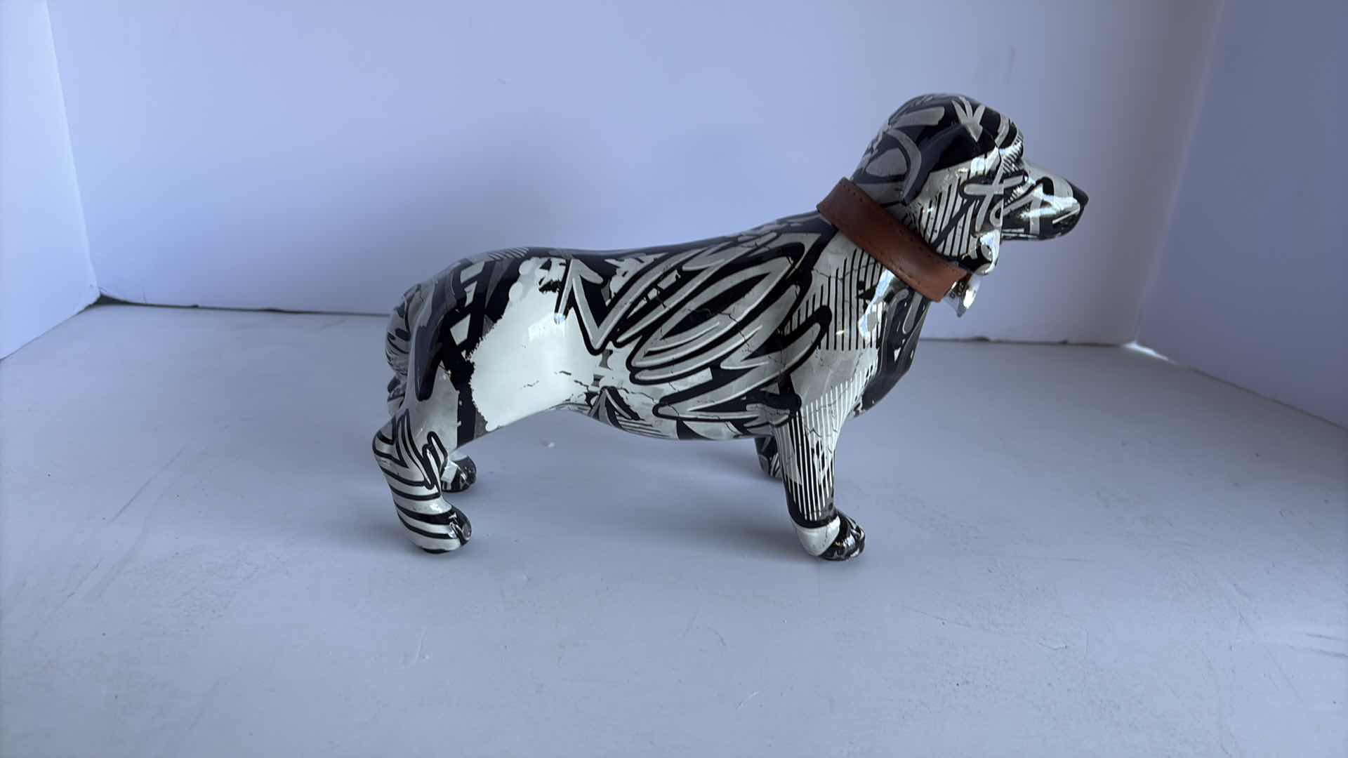Photo 1 of BRANI COLLECTION CERAMIC FIGURES BLACK AND WHITE DACHSHUND 11”X4”X7”H