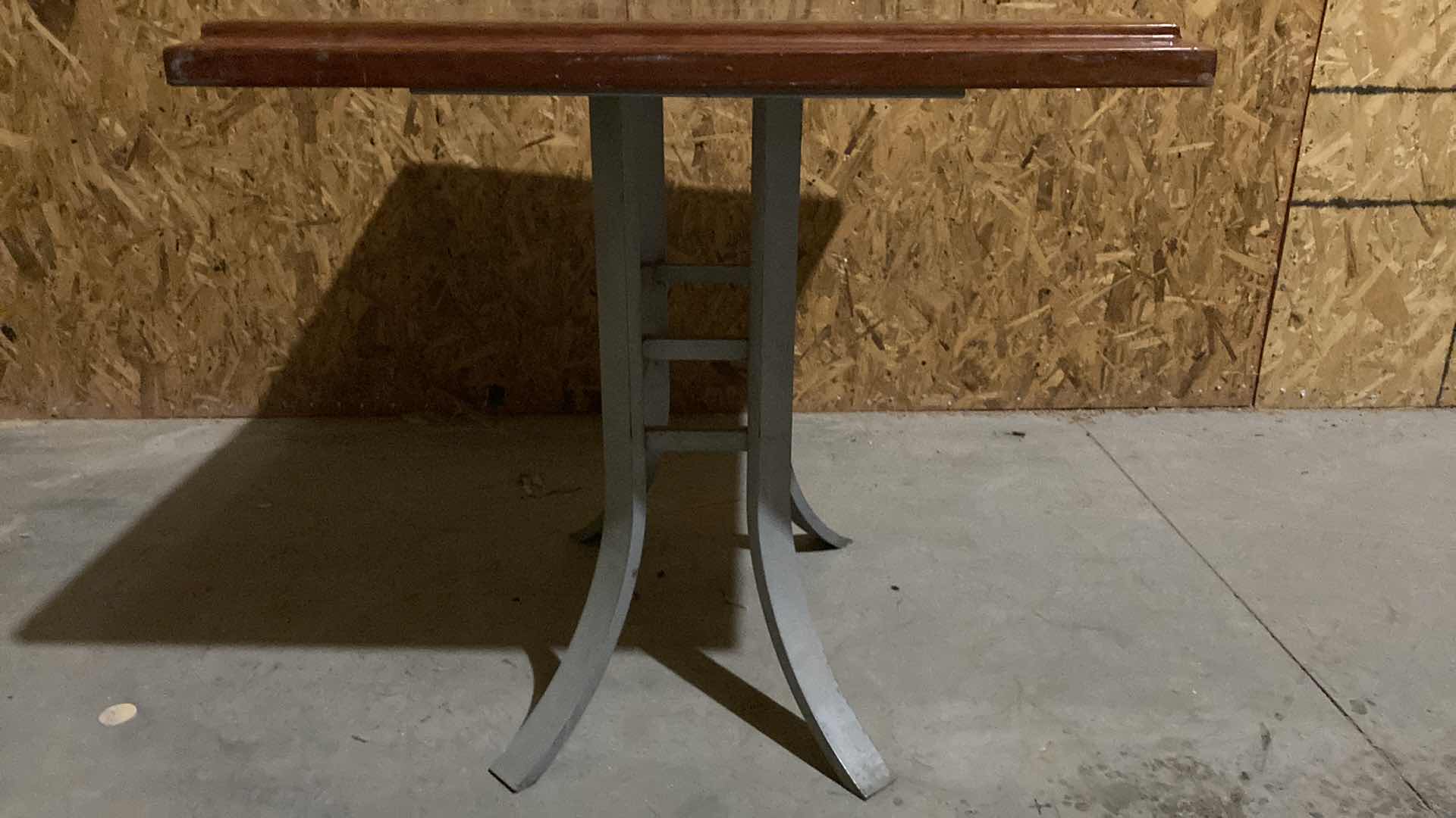 Photo 1 of DESIGN WORKS RESIN COATED TABLE TOP W SOLID STEEL BASE 38” X 30” H 30.5” (NO HARDWARE)