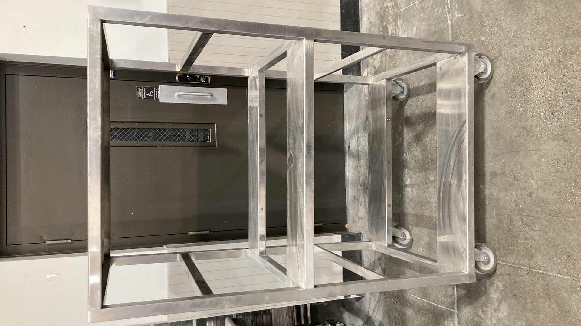 Photo 1 of STAINLESS STEEL ROLLING RACK 36.30” X 30” H 61”