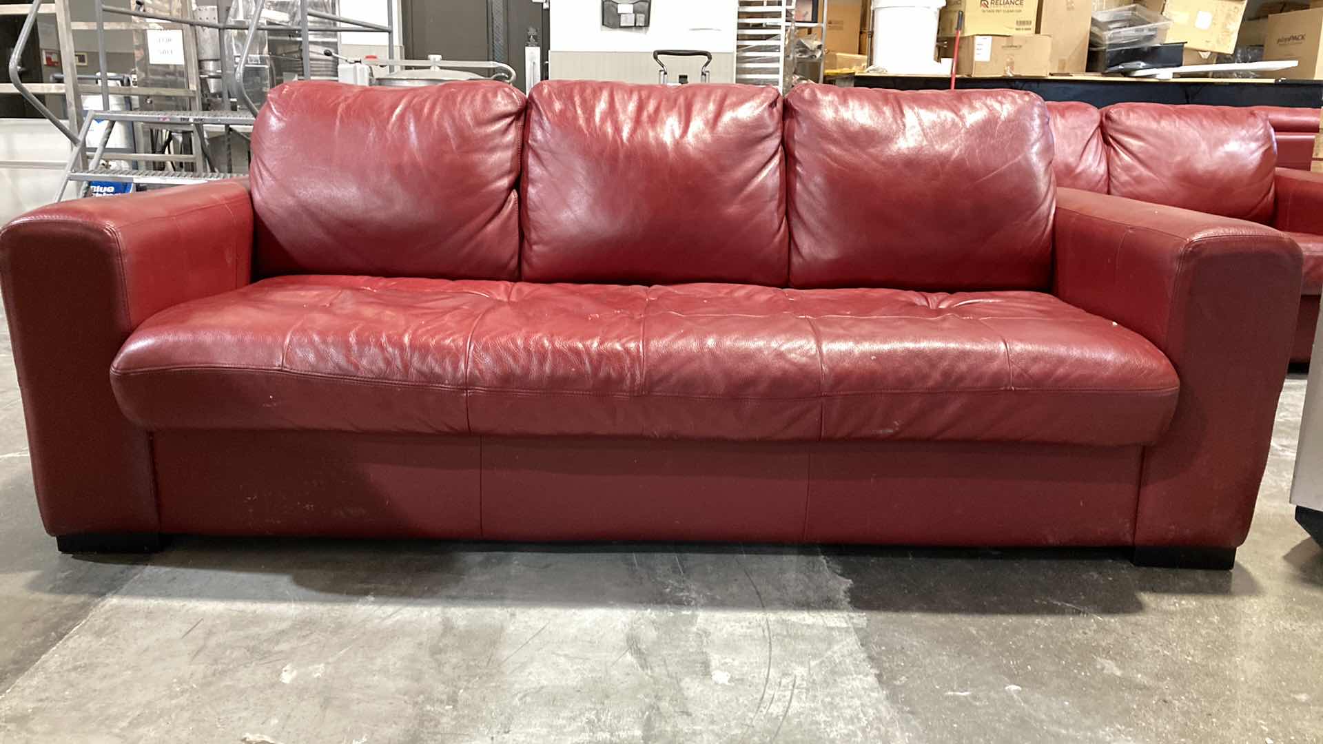 Photo 2 of F.D. STUDIOS ARTIFICIAL LEATHER RED SOFA 86” X 38” H 34” (DISPLAY MODEL)
