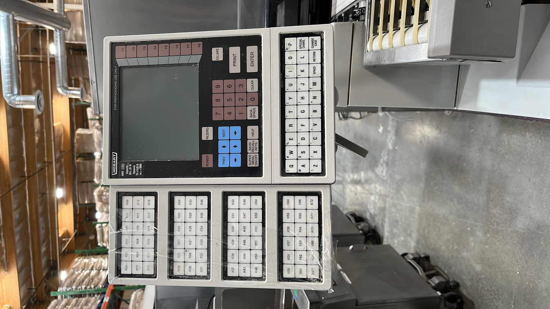 Photo 6 of HOBART COMMERCIAL DIGITAL DELI WRAPPING MACHINE W LABEL PRINTER MODEL UWS (HARDWIRED),  HEAT SEAL ENERGY SMART WRAPPER STATION W QUANTUM LABEL PRINTER (2),
HOBART ROLLER/DISCHARGE TABLE (MODEL HRT5-3)