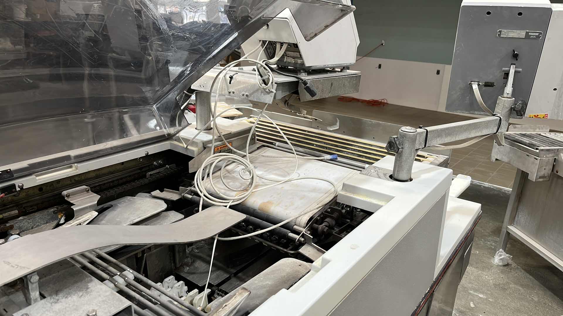 Photo 9 of HOBART COMMERCIAL DIGITAL DELI WRAPPING MACHINE W LABEL PRINTER MODEL UWS (HARDWIRED),  HEAT SEAL ENERGY SMART WRAPPER STATION W QUANTUM LABEL PRINTER (2),
HOBART ROLLER/DISCHARGE TABLE (MODEL HRT5-3)