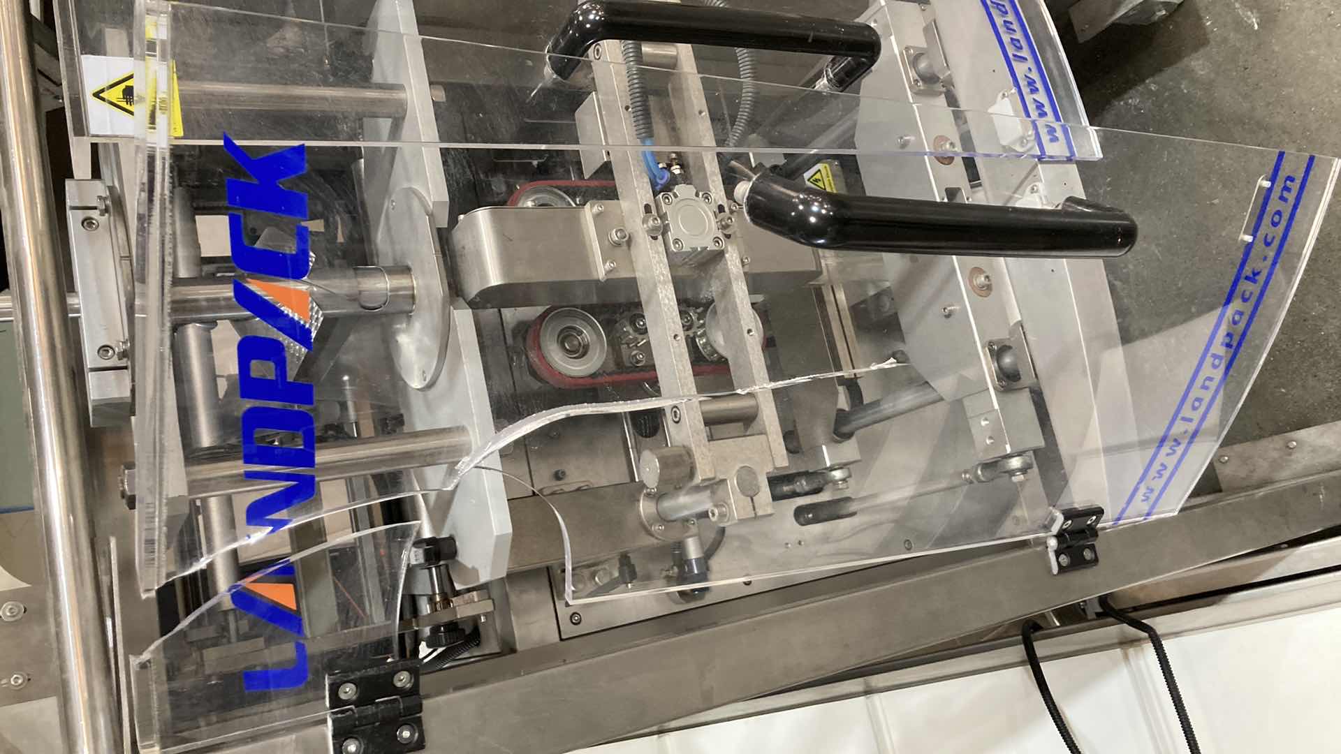 Photo 1 of LANDPACK COMMERCIAL AUTOMATIC LIQUID PACKAGING MACHINE MODEL LD-420L