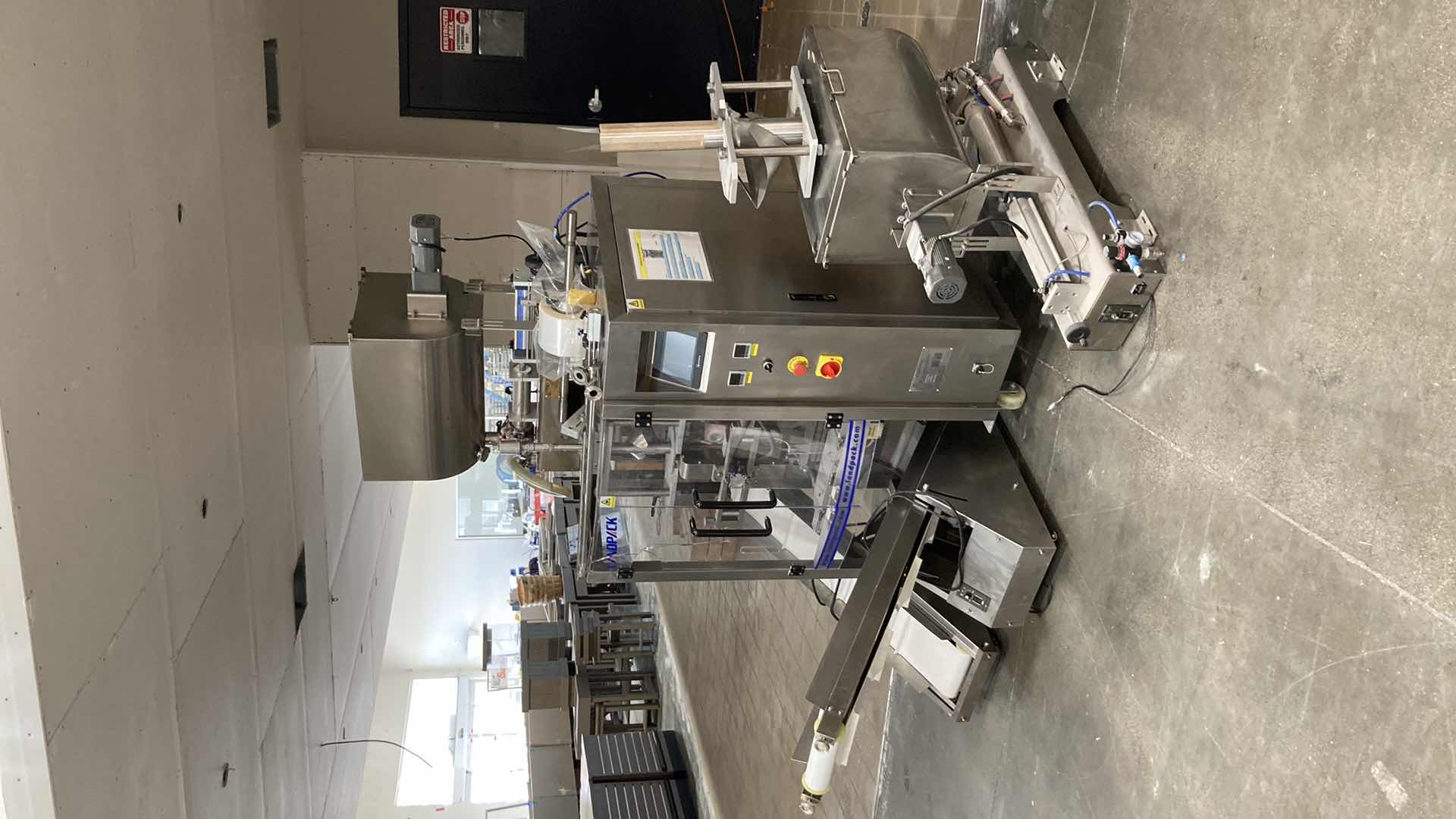 Photo 1 of LANDPACK COMMERCIAL AUTOMATIC LIQUID PACKAGING MACHINE MODEL LD-420L