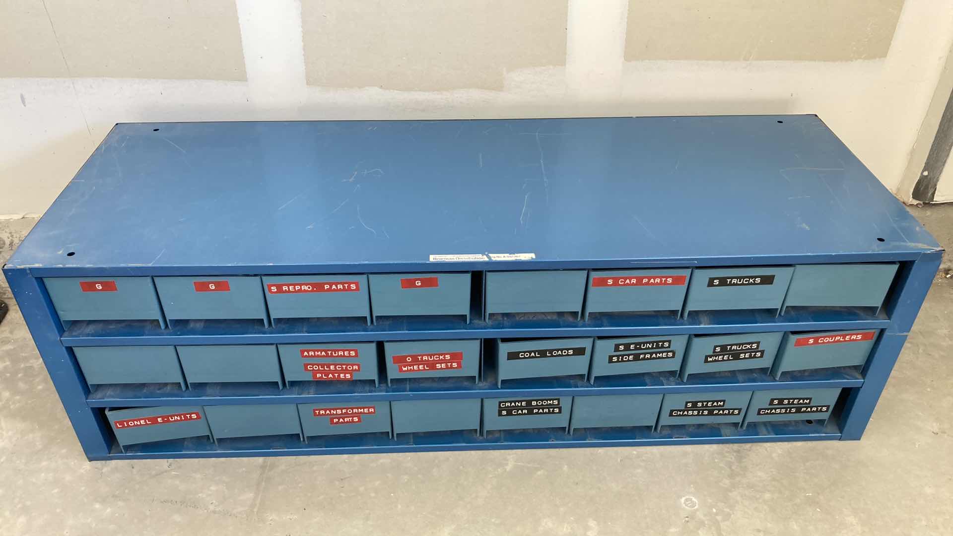 Photo 1 of BOWMAN 24 DRAWER STEEL STORAGE CABINET W MODEL TRAIN PARTS AS LABELED 35” X 12” H10.75”