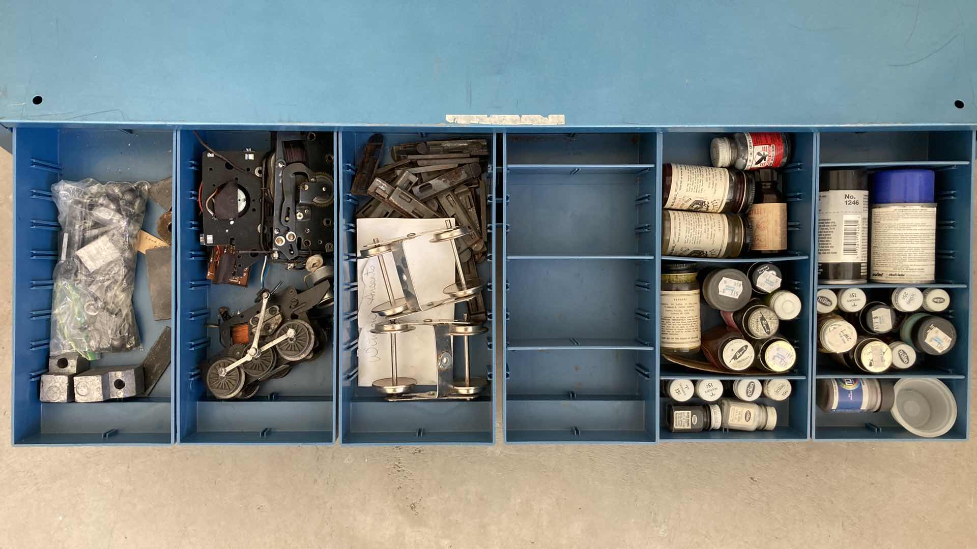 Photo 1 of BOWMAN 18 DRAWER STEEL STORAGE CABINET W MODEL TRAIN PARTS AS LABELED 35” X 12” H10.75”