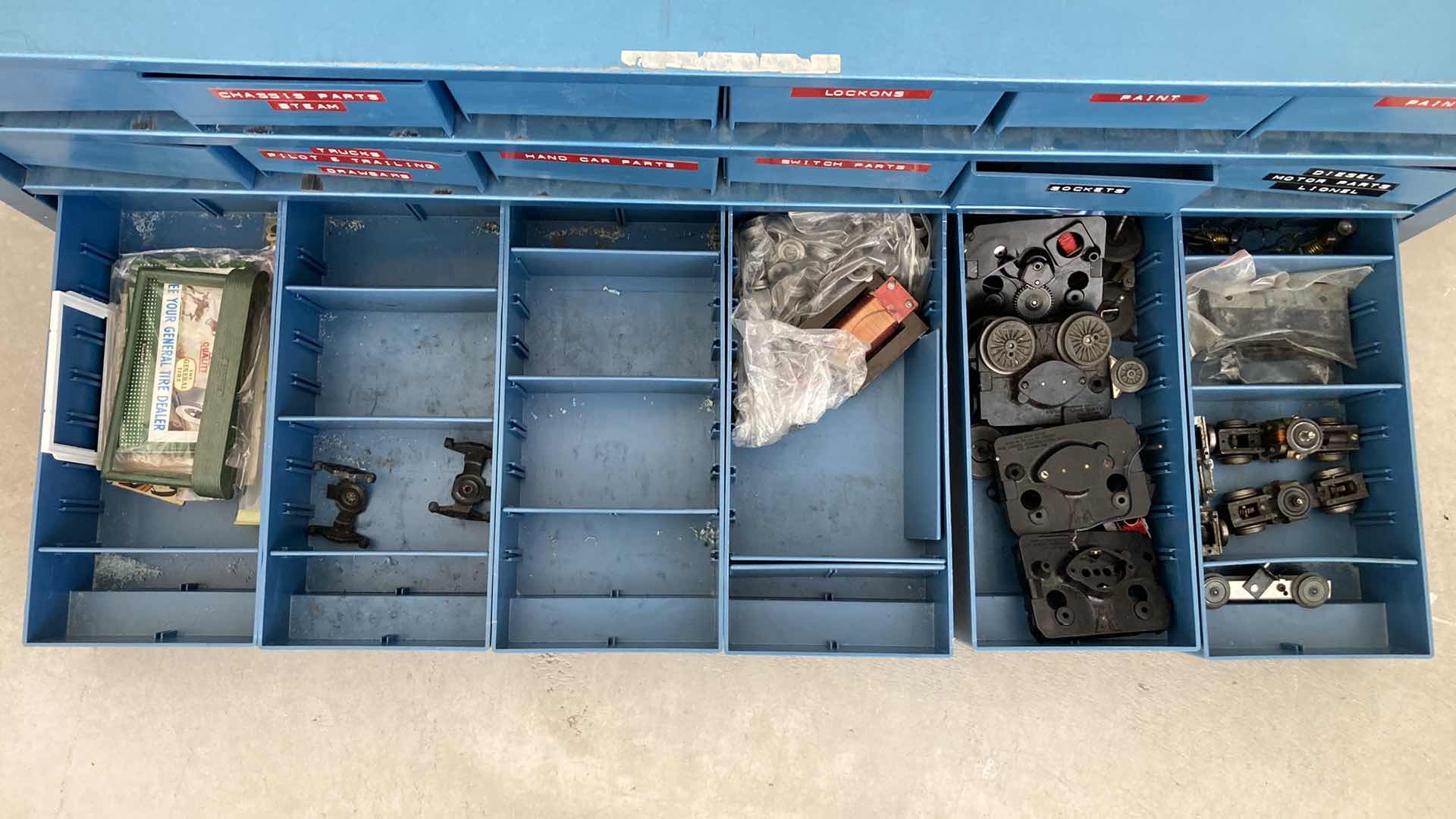 Photo 1 of BOWMAN 18 DRAWER STEEL STORAGE CABINET W MODEL TRAIN PARTS AS LABELED 35” X 12” H10.75”