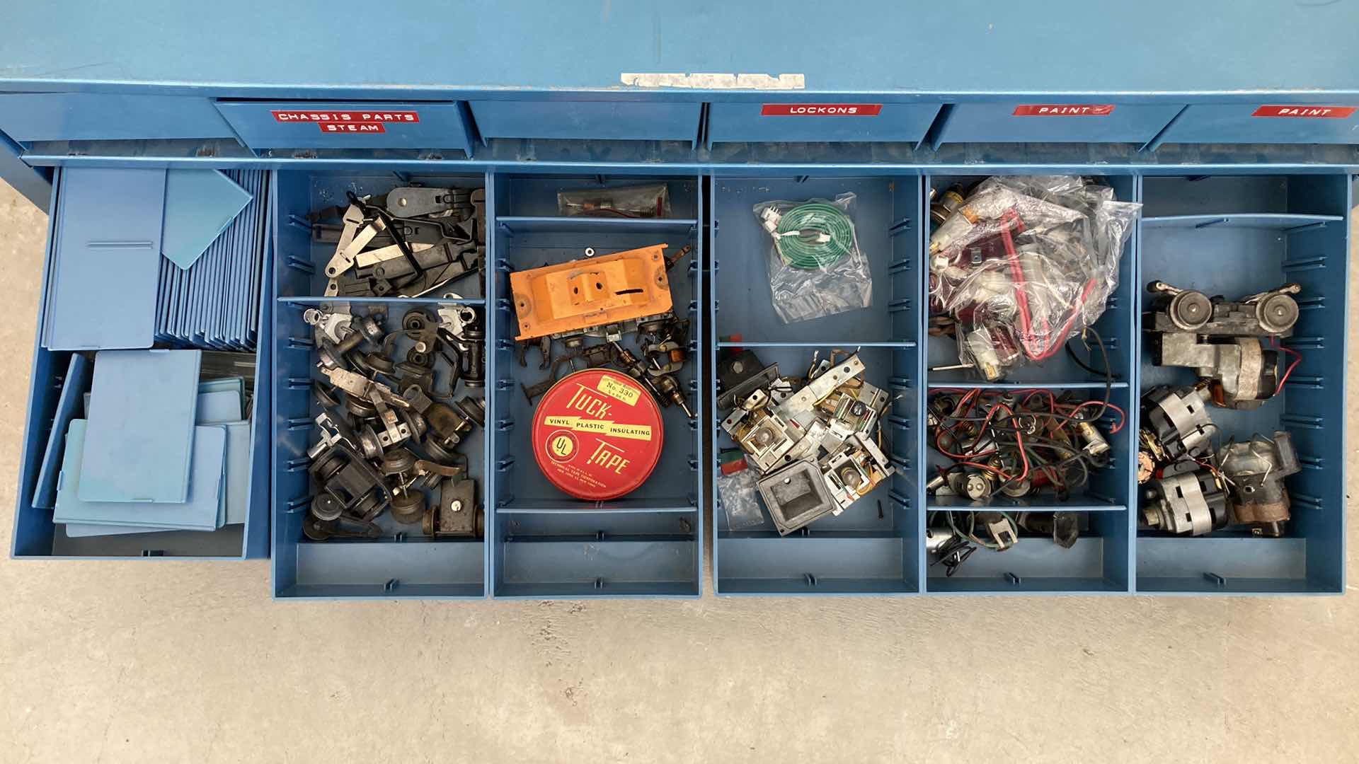 Photo 1 of BOWMAN 18 DRAWER STEEL STORAGE CABINET W MODEL TRAIN PARTS AS LABELED 35” X 12” H10.75”