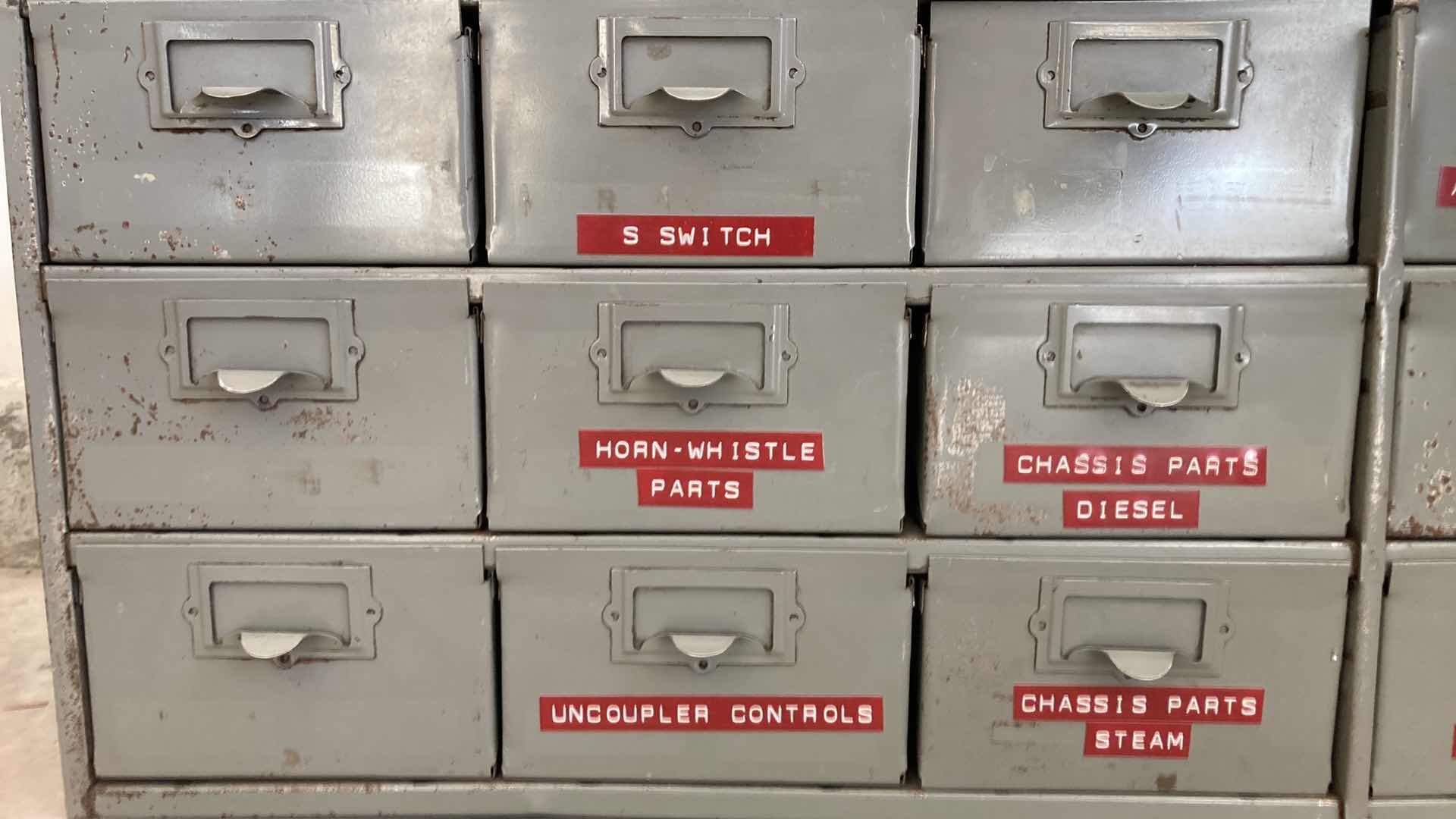 Photo 1 of 18 DRAWER STEEL STORAGE CABINET W MODEL TRAIN PARTS AS LABELED 34” X 12” H10.75”