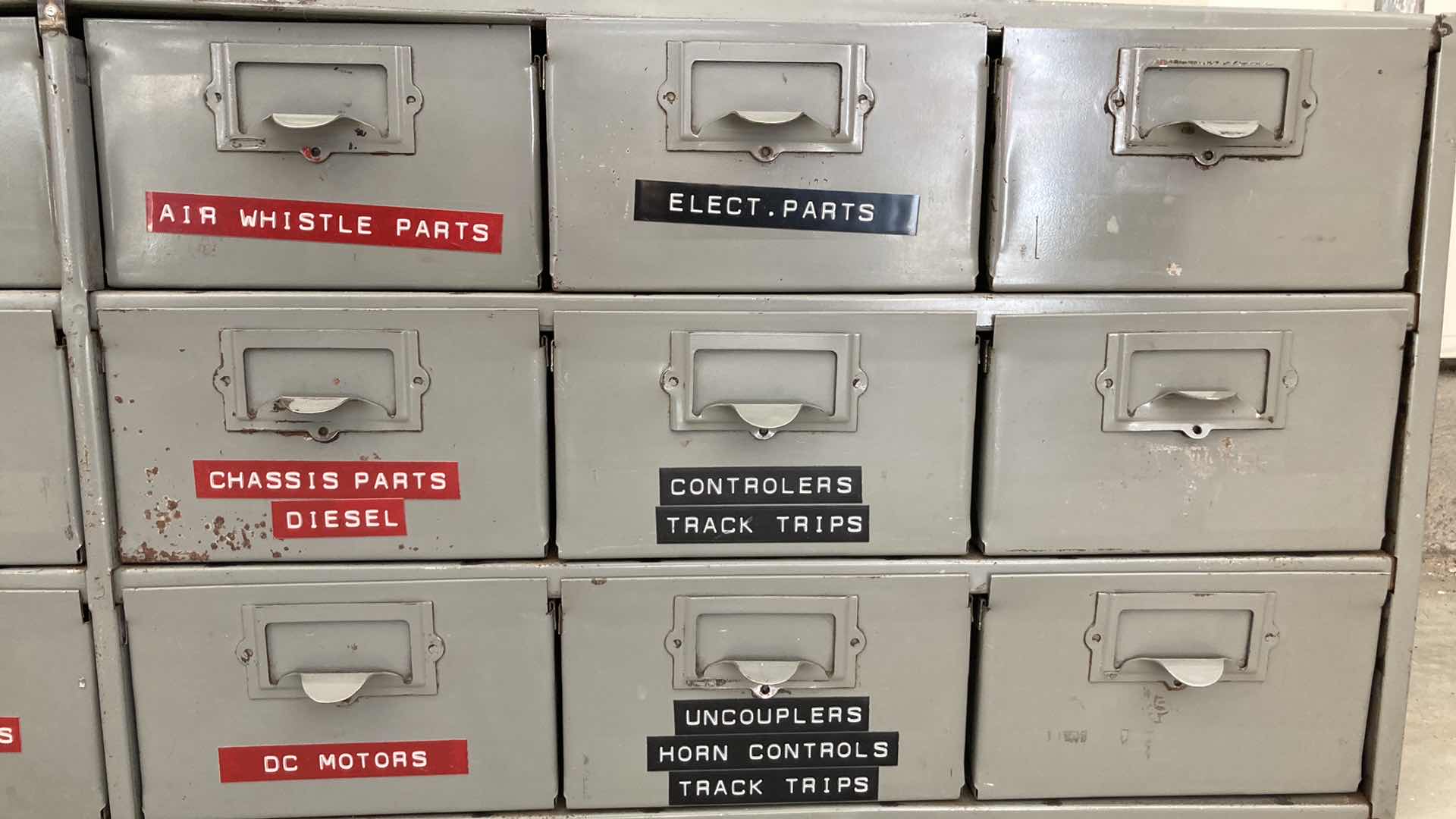 Photo 1 of 18 DRAWER STEEL STORAGE CABINET W MODEL TRAIN PARTS AS LABELED 34” X 12” H10.75”