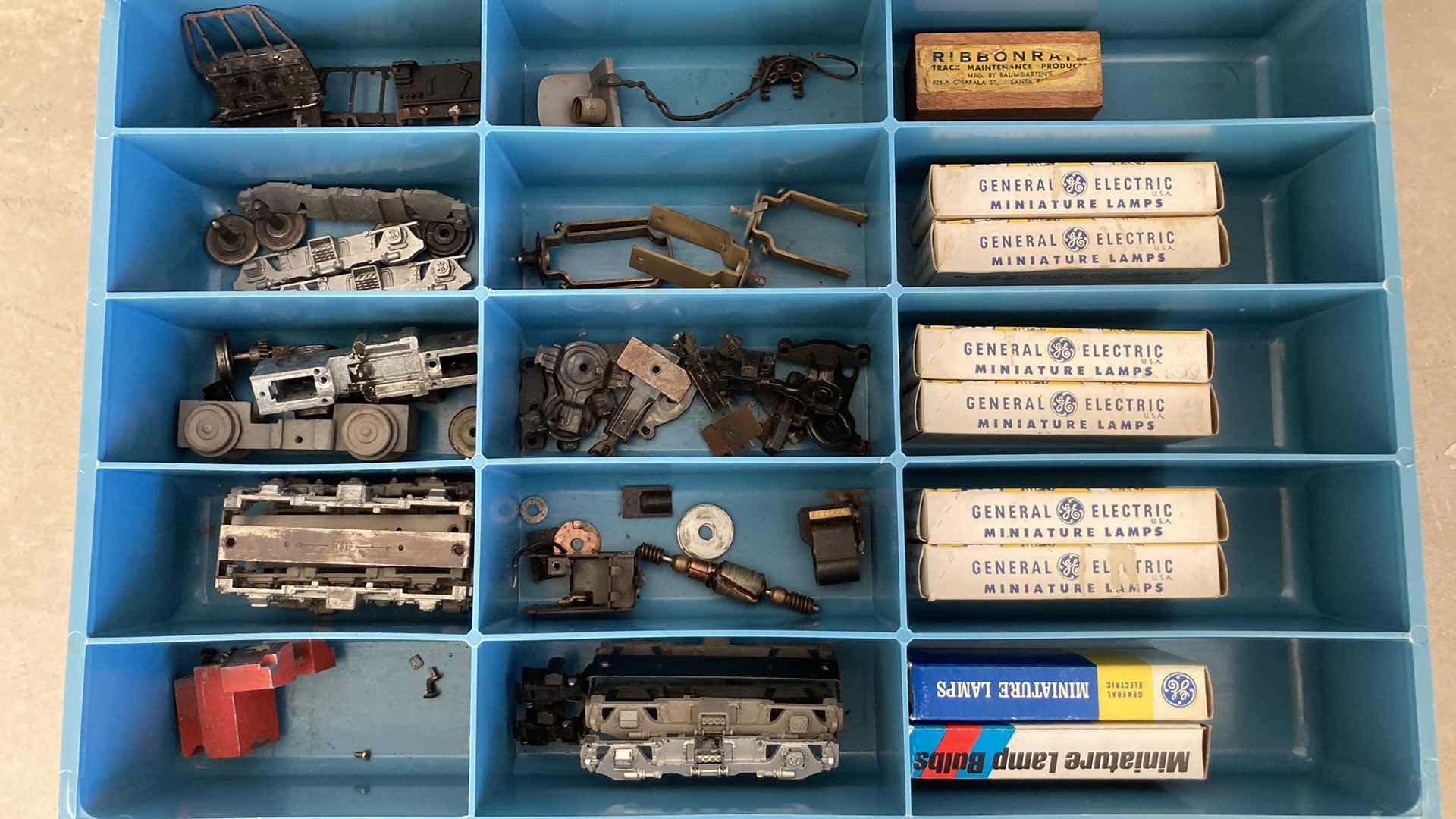 Photo 1 of BOWMAN 4 DRAWER STEEL STORAGE CABINET W MODEL TRAIN PARTS AS LABELED 20” X 16” H22”