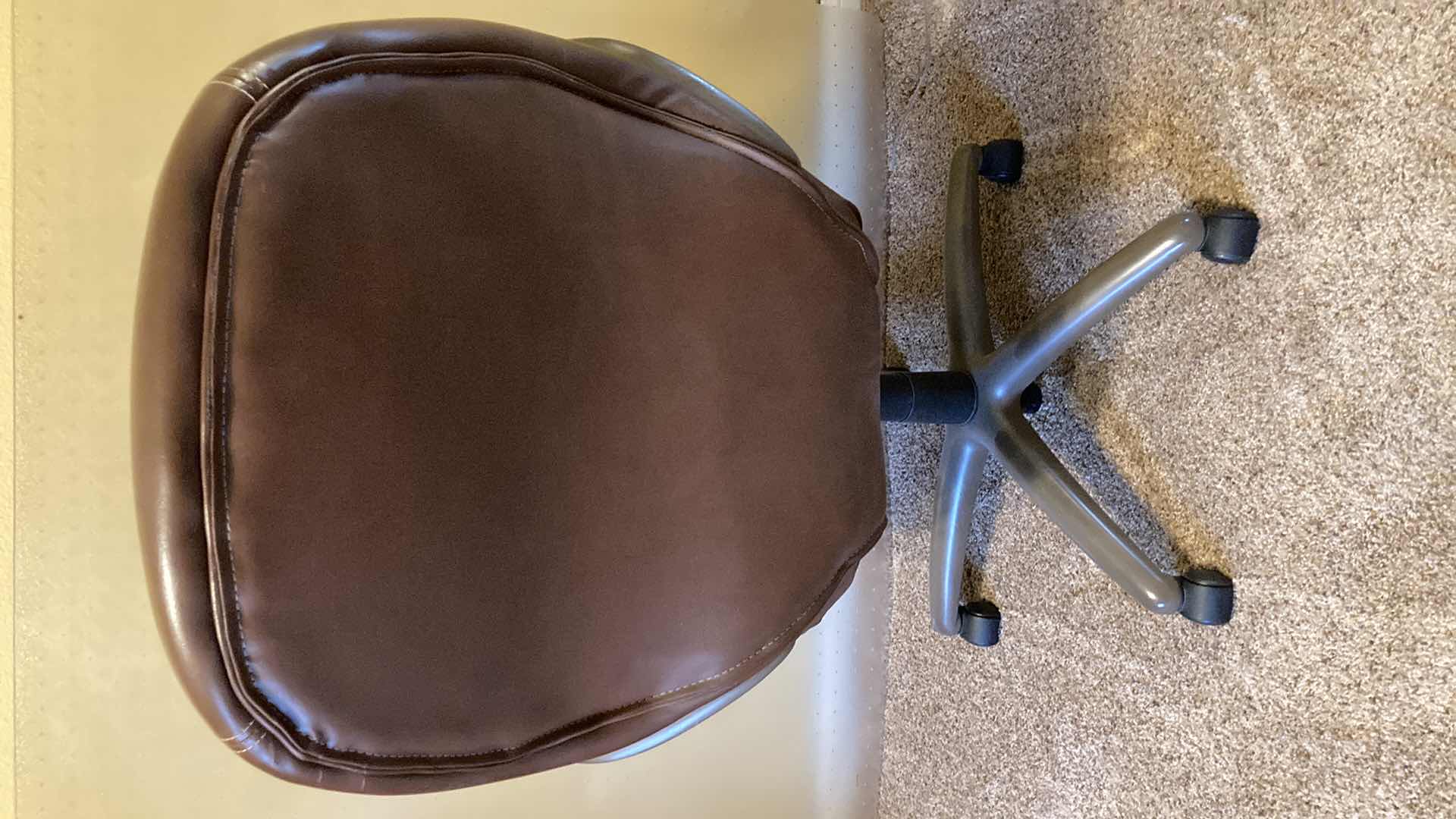 Photo 1 of TRUE SEATING BROWN LEATHER ROLLING OFFICE W PLASTIC ROLL MAT