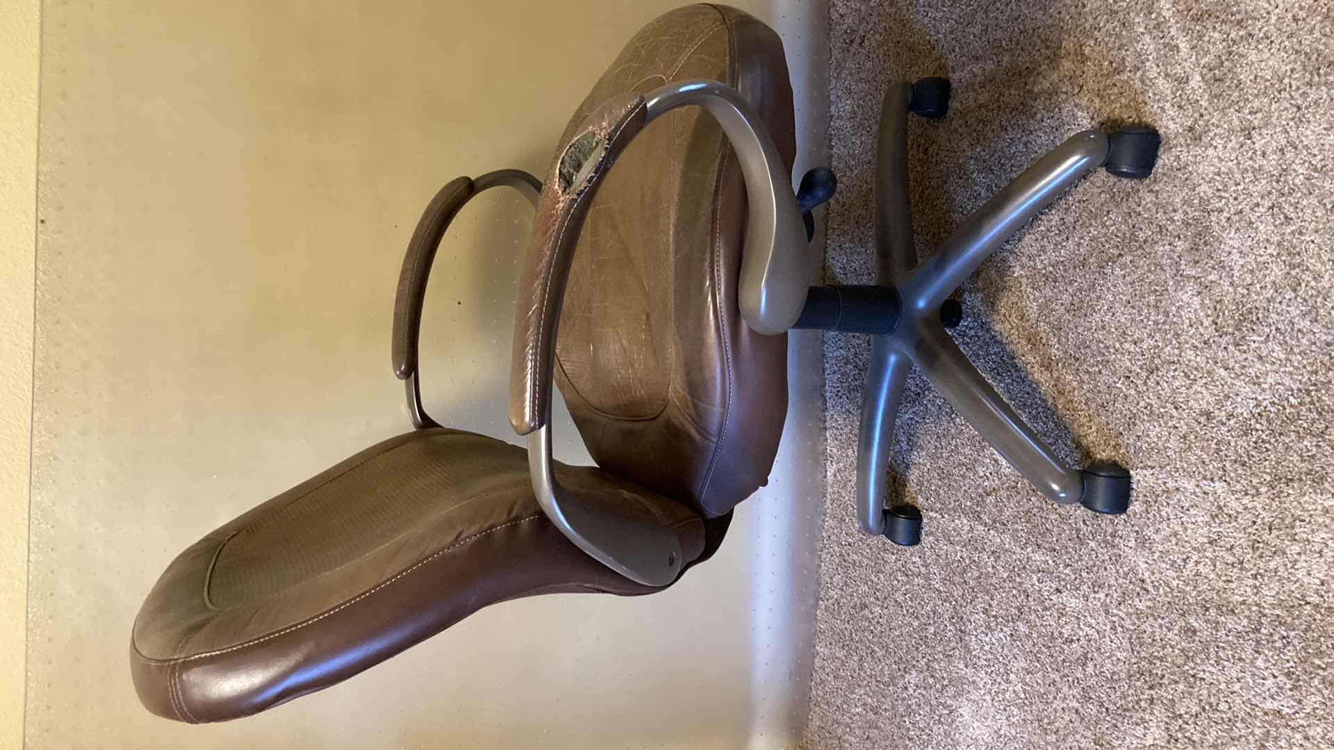 Photo 1 of TRUE SEATING BROWN LEATHER ROLLING OFFICE W PLASTIC ROLL MAT