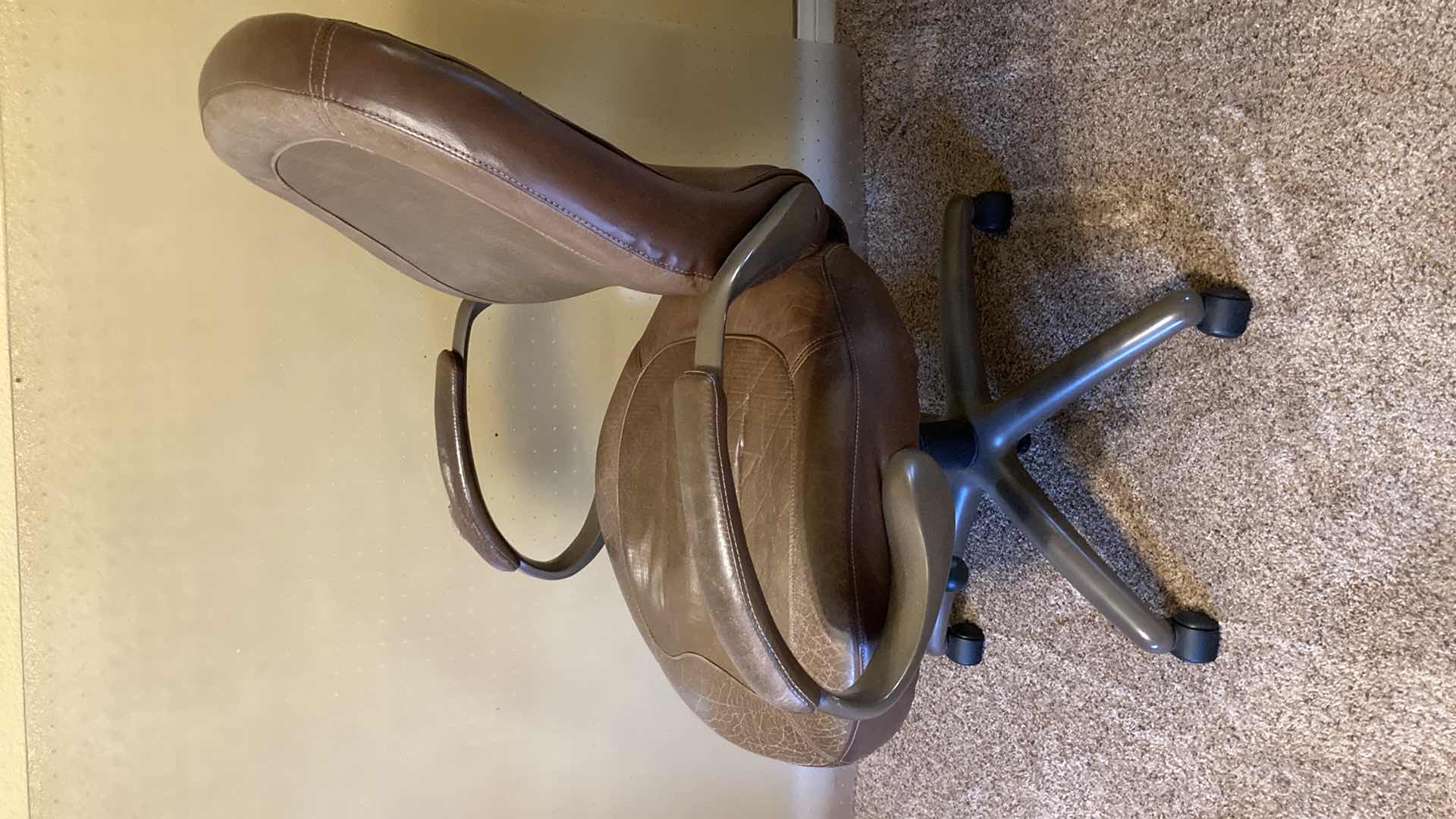 Photo 1 of TRUE SEATING BROWN LEATHER ROLLING OFFICE W PLASTIC ROLL MAT