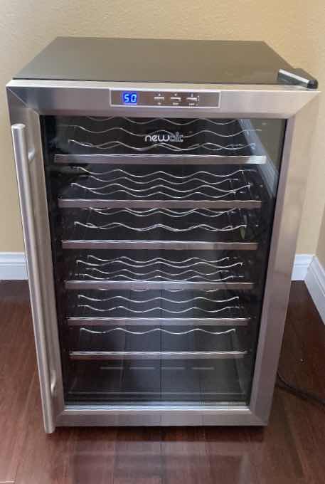 Photo 1 of NEWAIR STAINLESS STEEL & BLACK THERMOELECTRIC WINE COOLER MODEL AW-281E