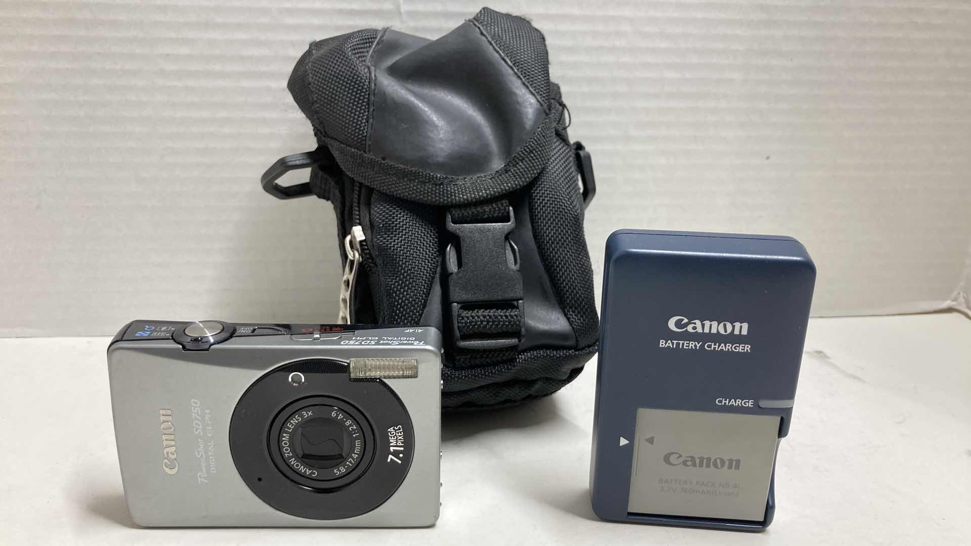 Photo 1 of PANASONIC DVD VIDEO CAMERA MODEL VDR-D220 & CANON POWERSHOT DIGITAL CAMERA MODEL SD750 W CHARGERS, BATTERIES & EXPEDITION OUTFITTERS CAMERA BAG