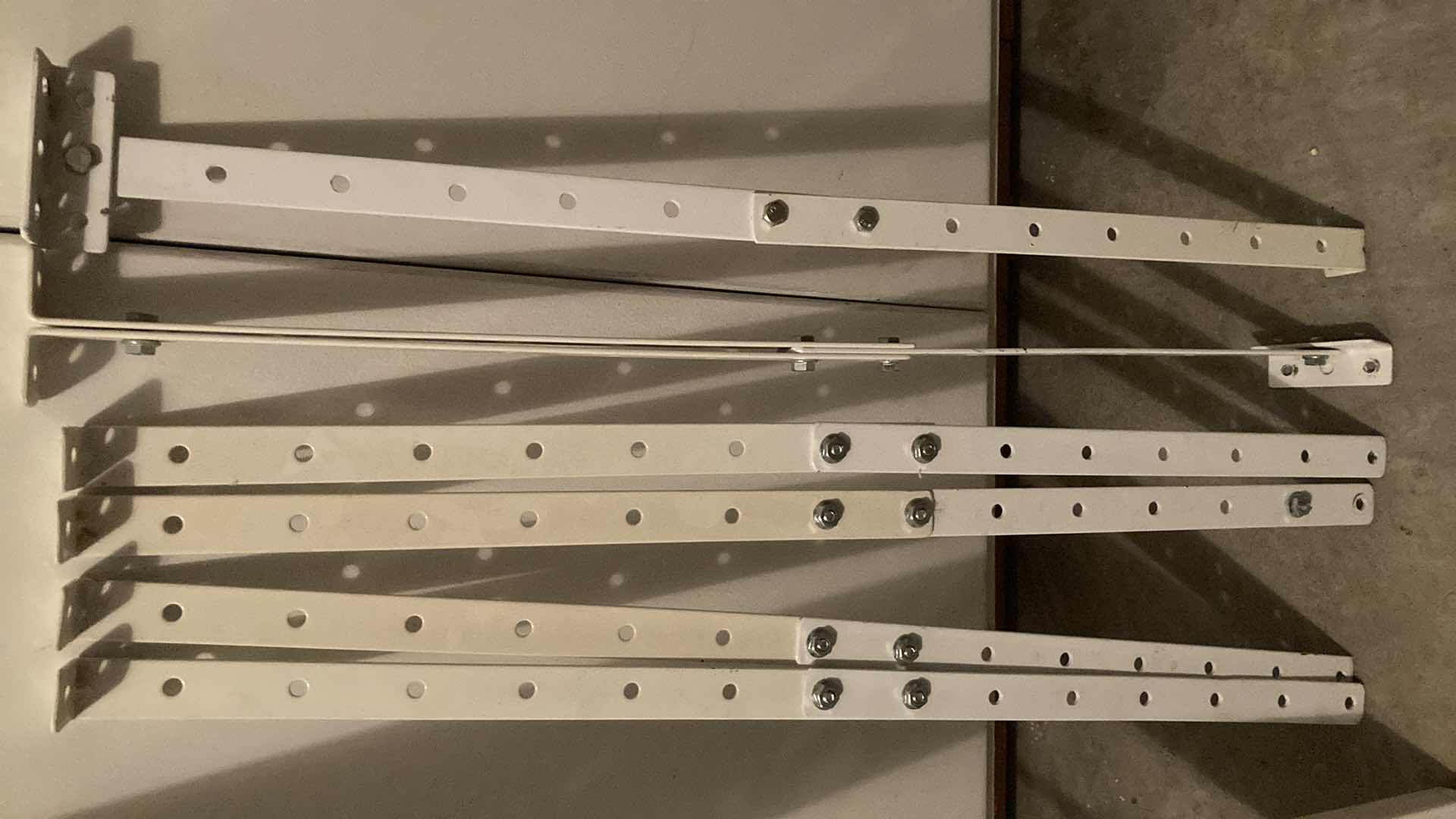 Photo 1 of WHITE METAL GRATED 6 TIER SHELF 44” X 13”-15” H46”