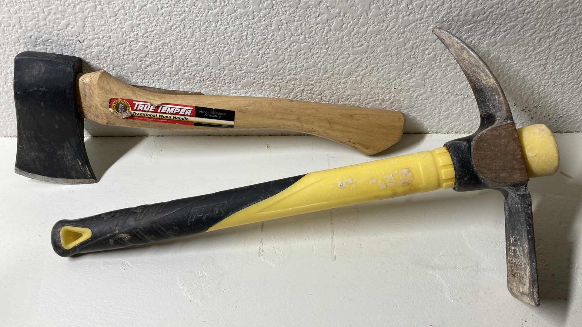 Photo 1 of TRUE TEMPER WOOD HANDLED HATCHET & LUDELL FIBERGLASS HANDLED HAND HELD PICK AXE