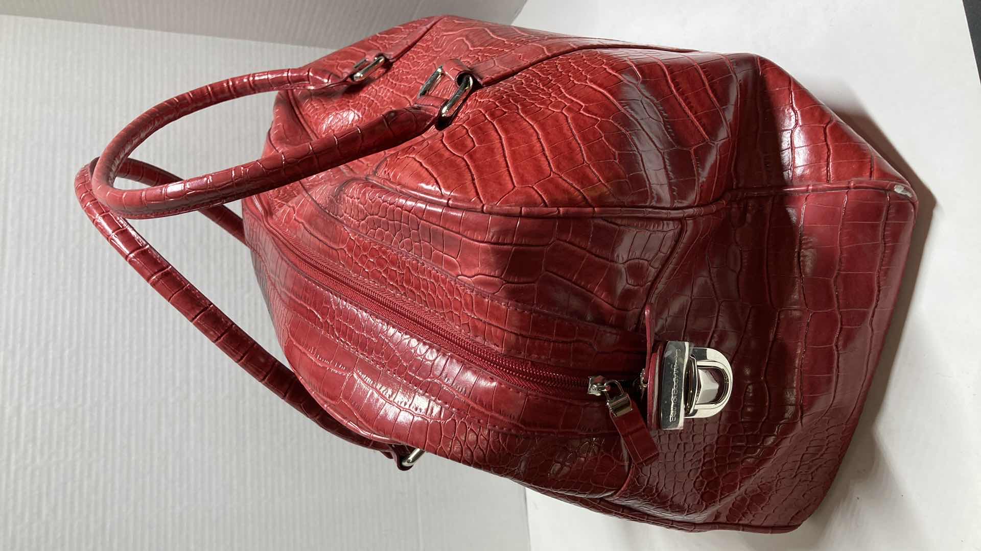 View 2 of BATH & BODYWORKS RED ALLIGATOR SKIN FINISH TRAVEL BAG 20” X 12”