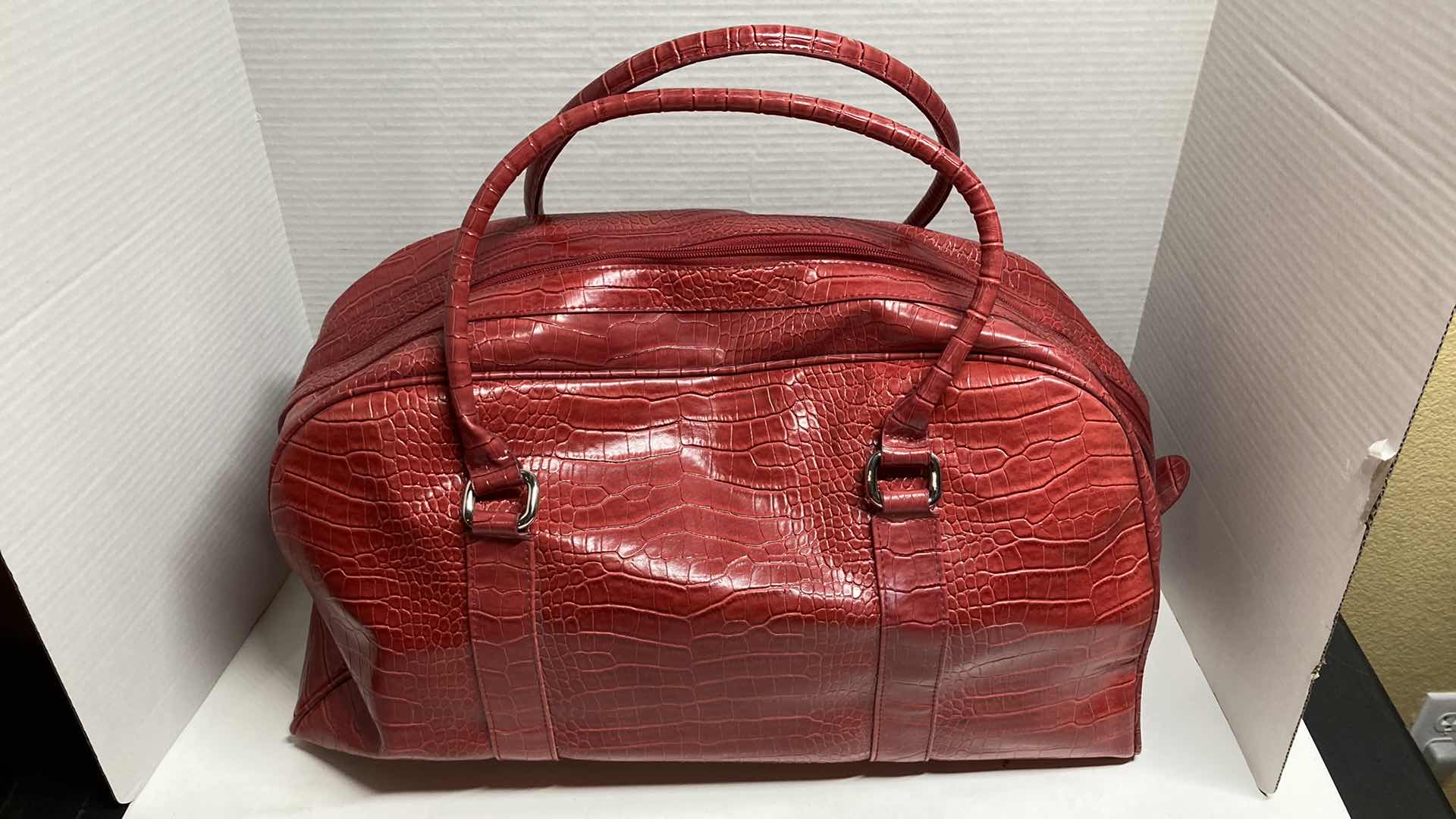 View 1 of BATH & BODYWORKS RED ALLIGATOR SKIN FINISH TRAVEL BAG 20” X 12”