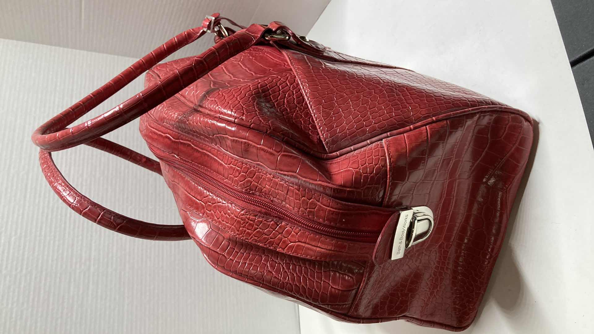 View 4 of BATH & BODYWORKS RED ALLIGATOR SKIN FINISH TRAVEL BAG 20” X 12”