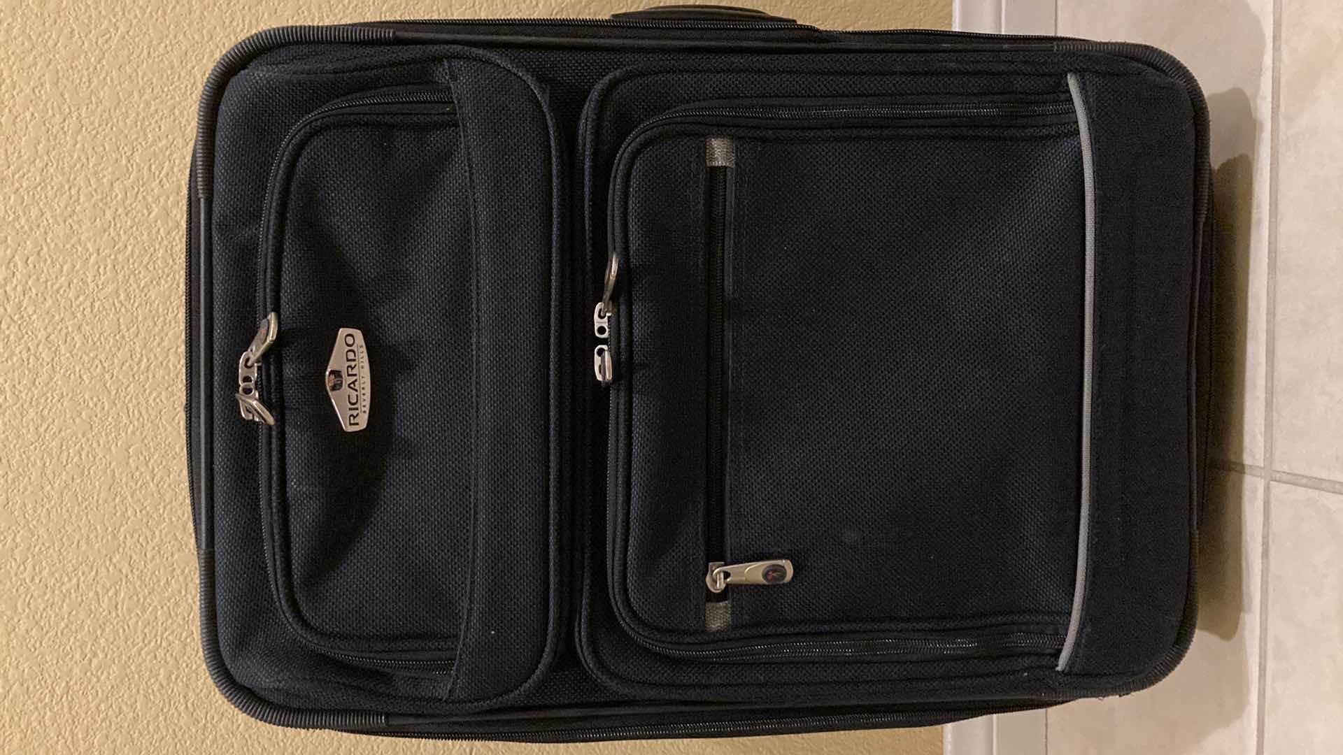 Photo 1 of RICARDO BLACK LUGGAGE SET- ROLLING CARRY ON BAG, SHOULDER BAG & DUFFLE BAG (3)