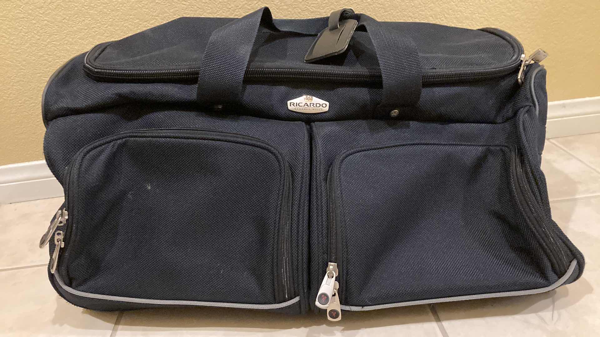 Photo 1 of RICARDO BLACK LUGGAGE SET- ROLLING CARRY ON BAG, SHOULDER BAG & DUFFLE BAG (3)