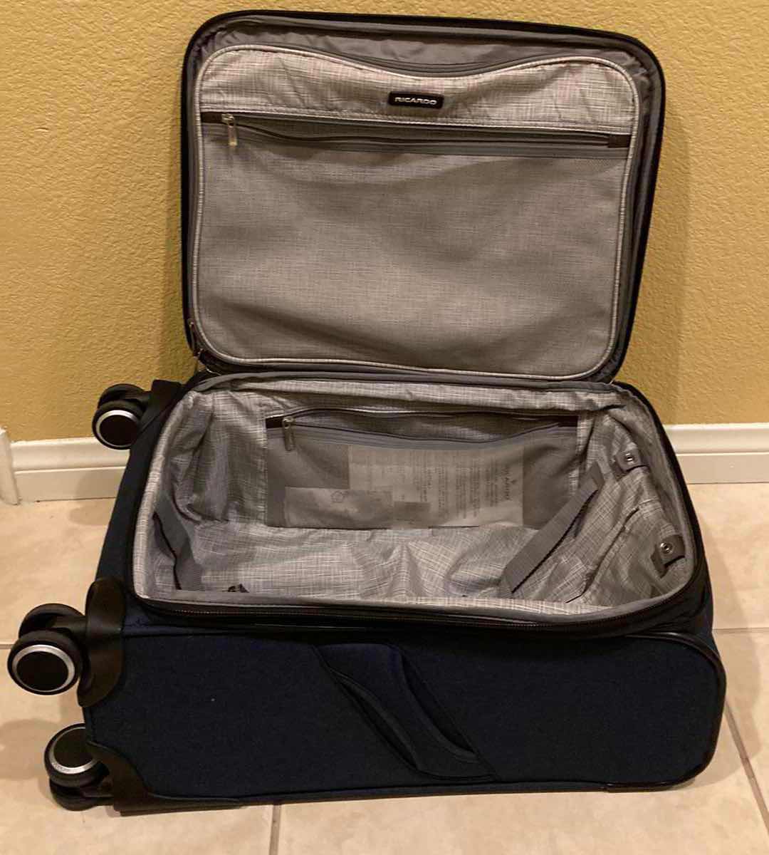 Photo 1 of RICARDO NAVY BLUE ROLLING CARRY ON BAG