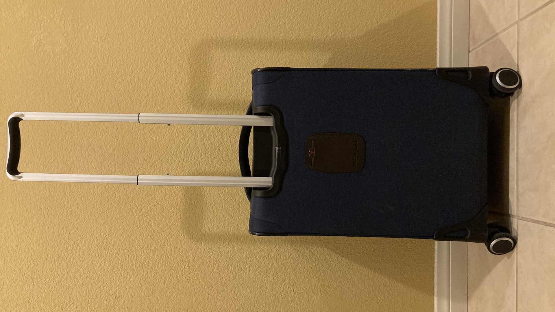 Photo 1 of RICARDO NAVY BLUE ROLLING CARRY ON BAG