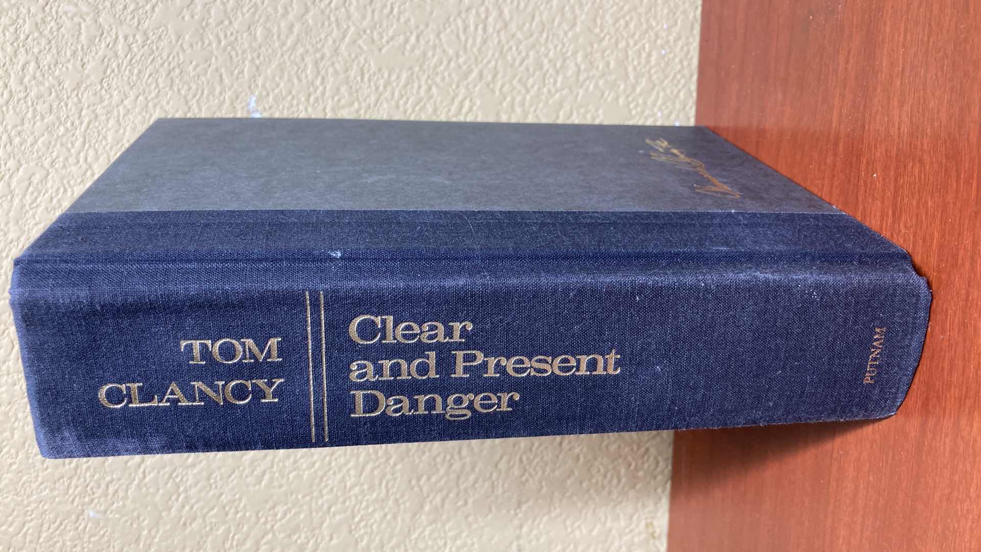 Photo 1 of CLEAR AND PRESENT DANGER AUTOGRAPHED BY TOM CLANCY HARD COVER BOOK