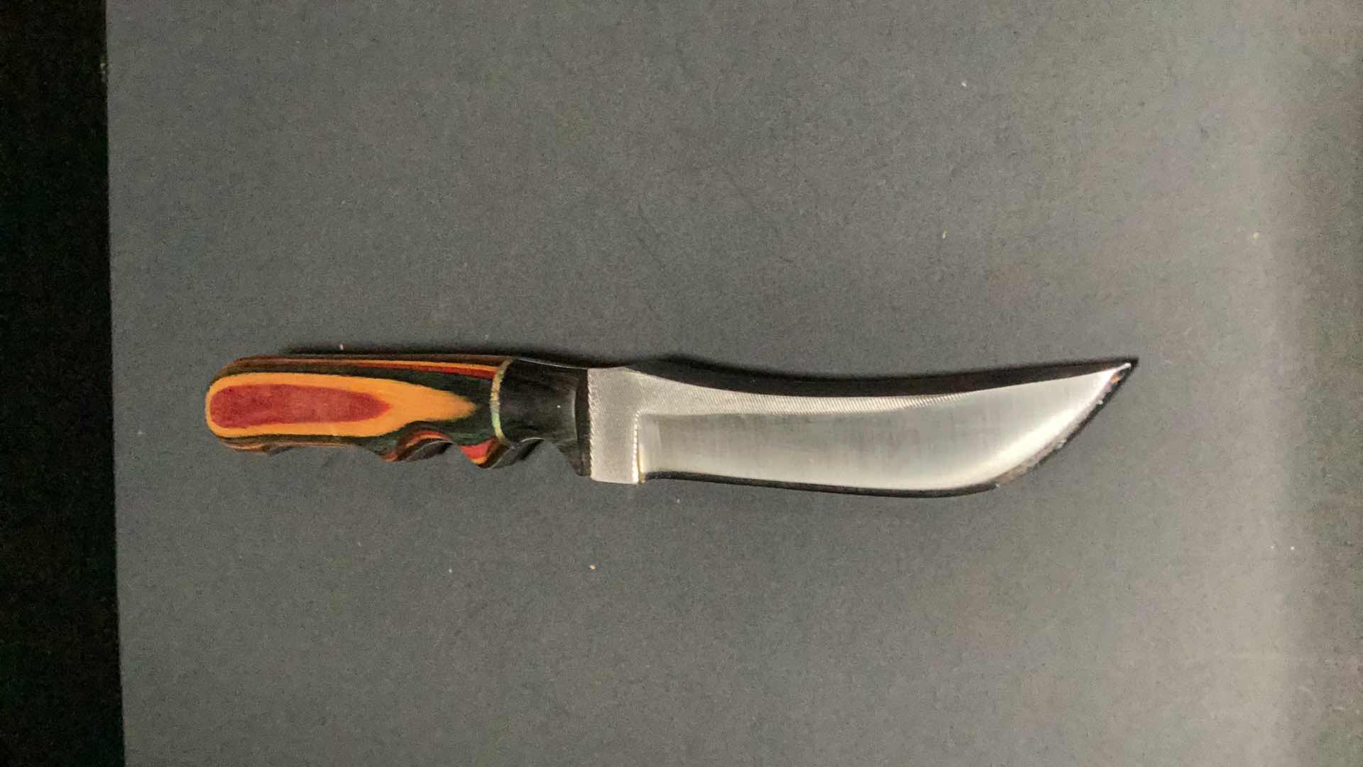 Photo 1 of MULTICOLORED WOODEN HANDLED 8” KNIFE