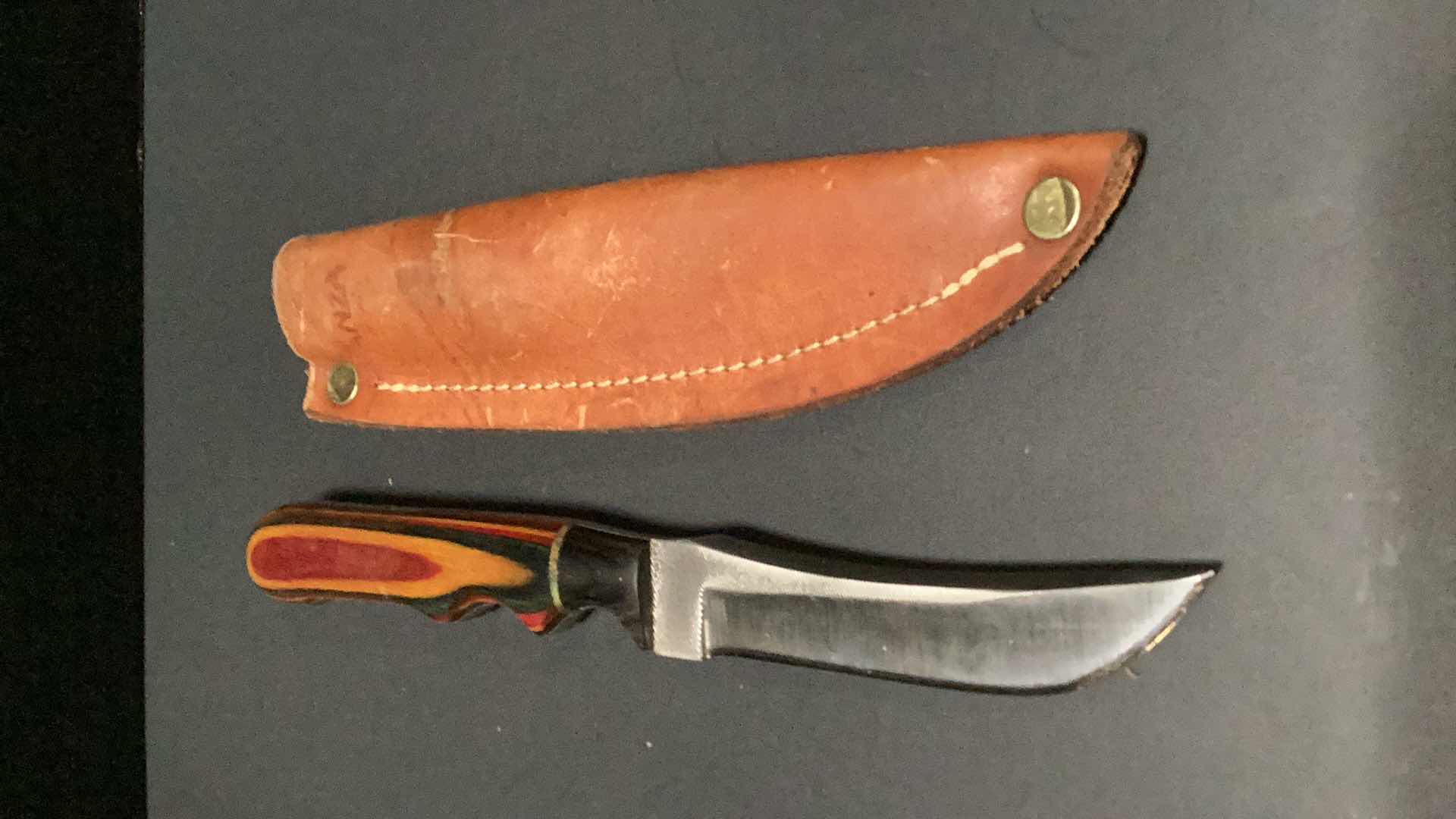 Photo 1 of MULTICOLORED WOODEN HANDLED 8” KNIFE