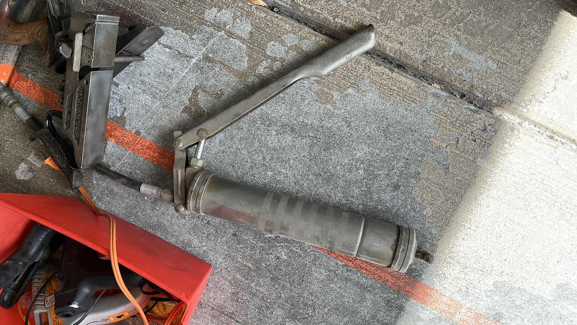 Photo 2 of GREASE GUN AND HAND PLANERS AND GLUE GUNS