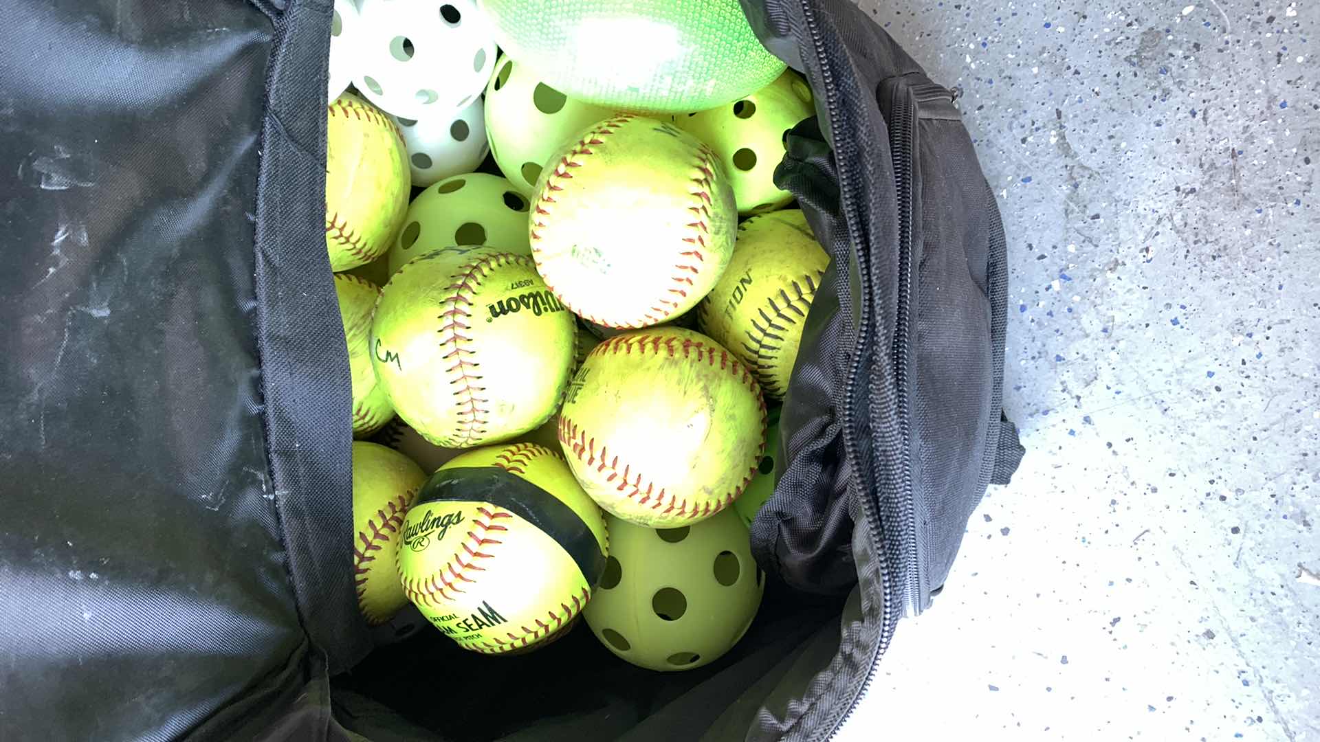 Photo 1 of BACKPACK FULL OF SOFTBALLS AND WIFFLE BALLS