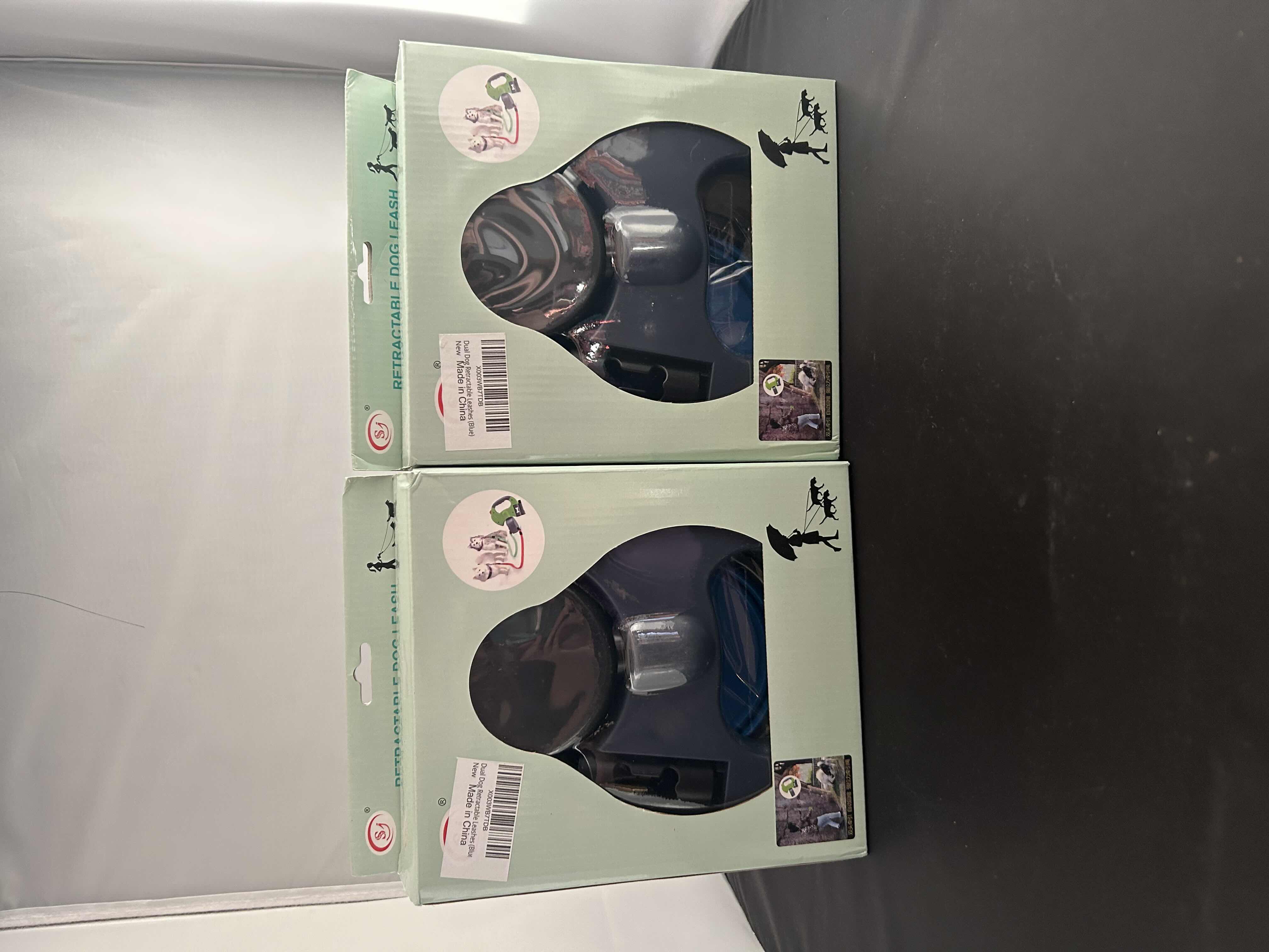 Photo 1 of 2 - BRAND NEW SJ RETRACTABLE DUAL DOG LEASHES WITH LIGHT, POOP BAG DISPENSER, AND TRAVEL BOWL