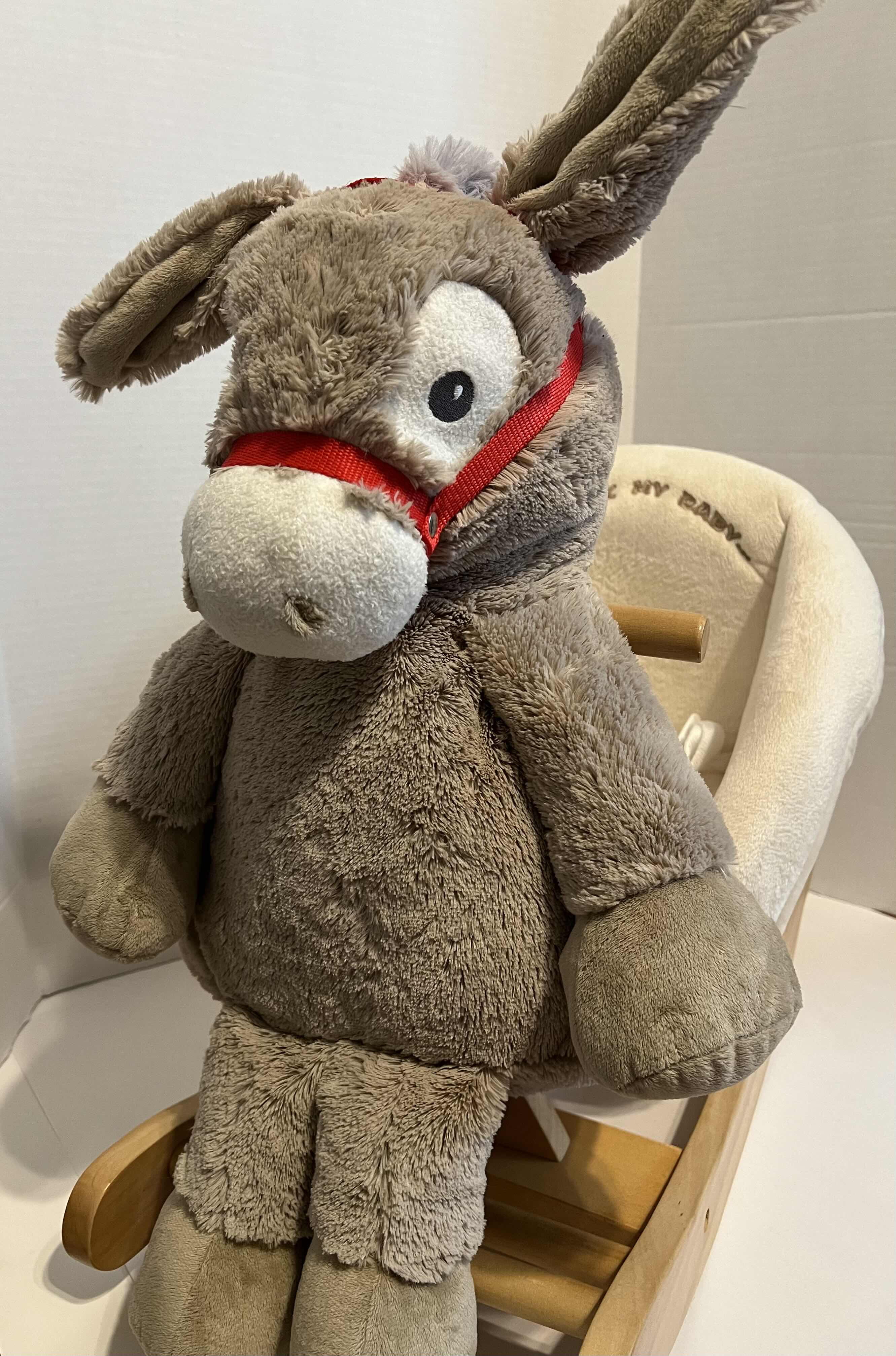 Photo 1 of BABY ROCKING STUFFED DONKEY. LIKE NEW. PLUSH, GRAY AND CREAM COLORED WITH SAFETY BELT. WOODEN ROCKING TRACKS.