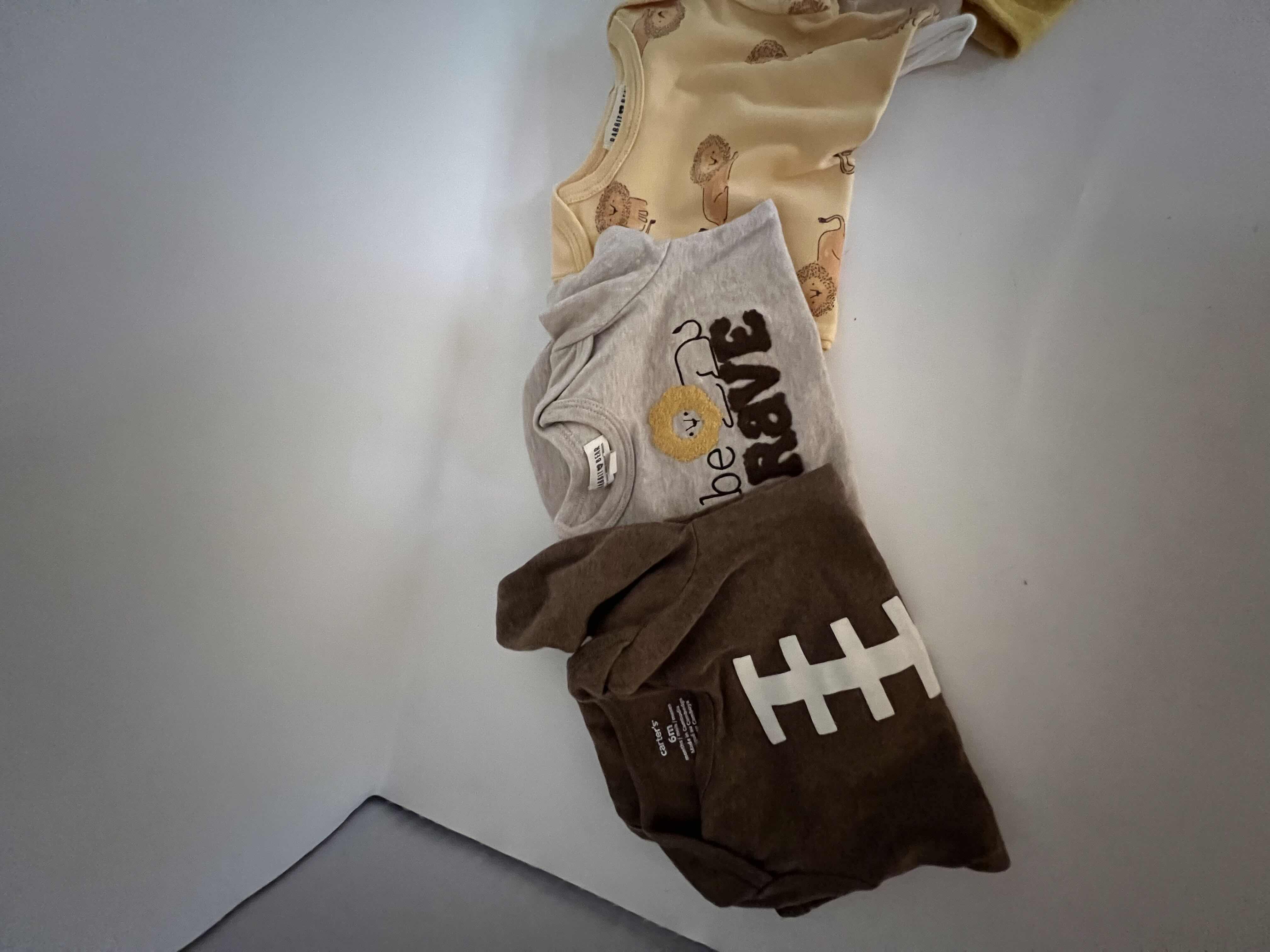 Photo 1 of 11-GENTLY USED BABY CLOTHES AND BIBS. VARIETY OF ONSIES 3-9 MONTHS. GREAT FOR BOTH GIRLS AND BOYS.