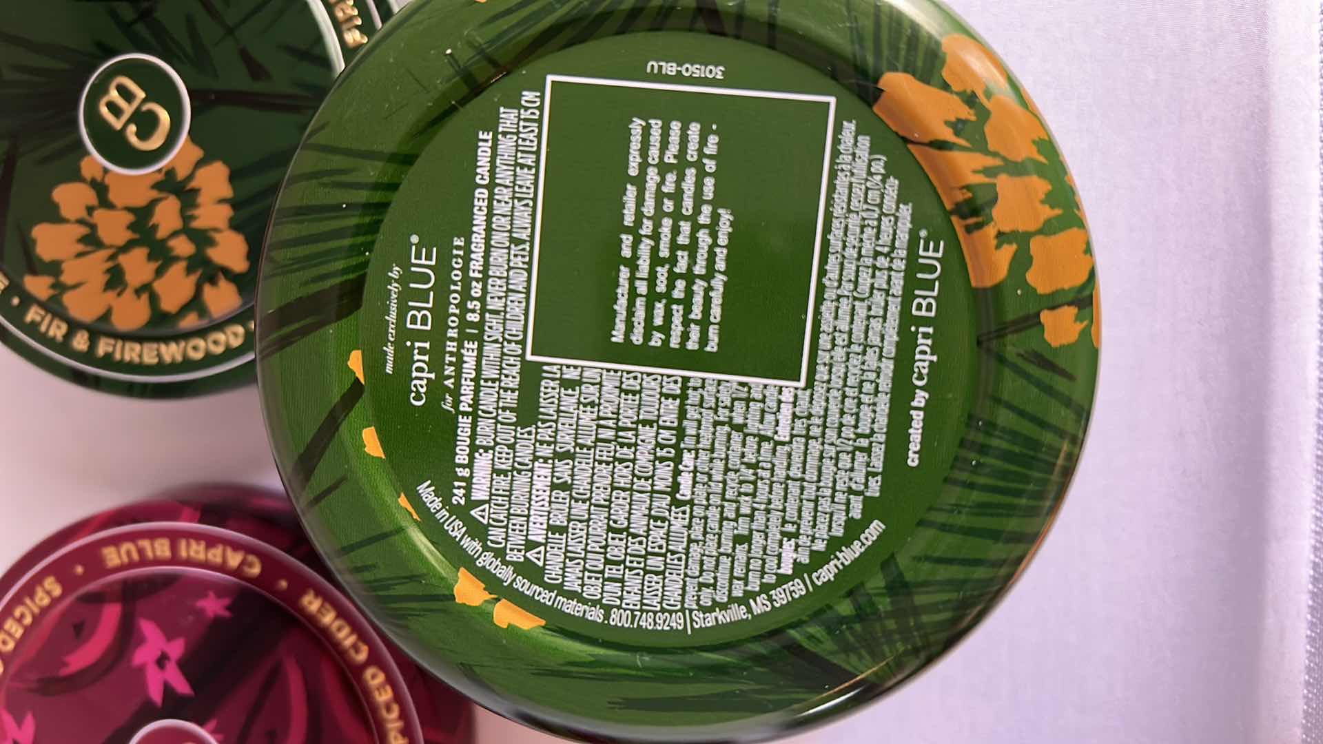 Photo 1 of 2-BRAND NEW ANTHROPOLOGY X CAPRI BLUE 8.5 OZ CANDLES. SCENTS: “FIR AND FIREWOOD” AND “SPICED CIDER.”