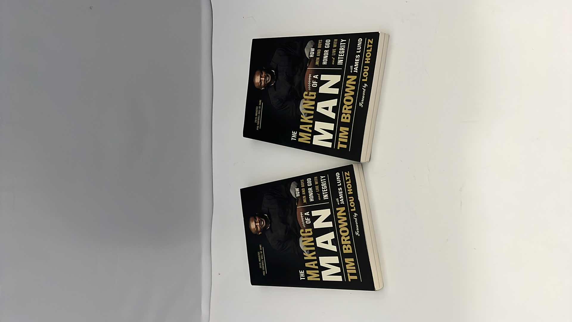 Photo 1 of 2-BRAND NEW BOOKS. NFL HALL OF FAMER SIGNED BOOKS BY “TIM BROWN.” “MAKING OF A MAN” BIOGRAPHY.