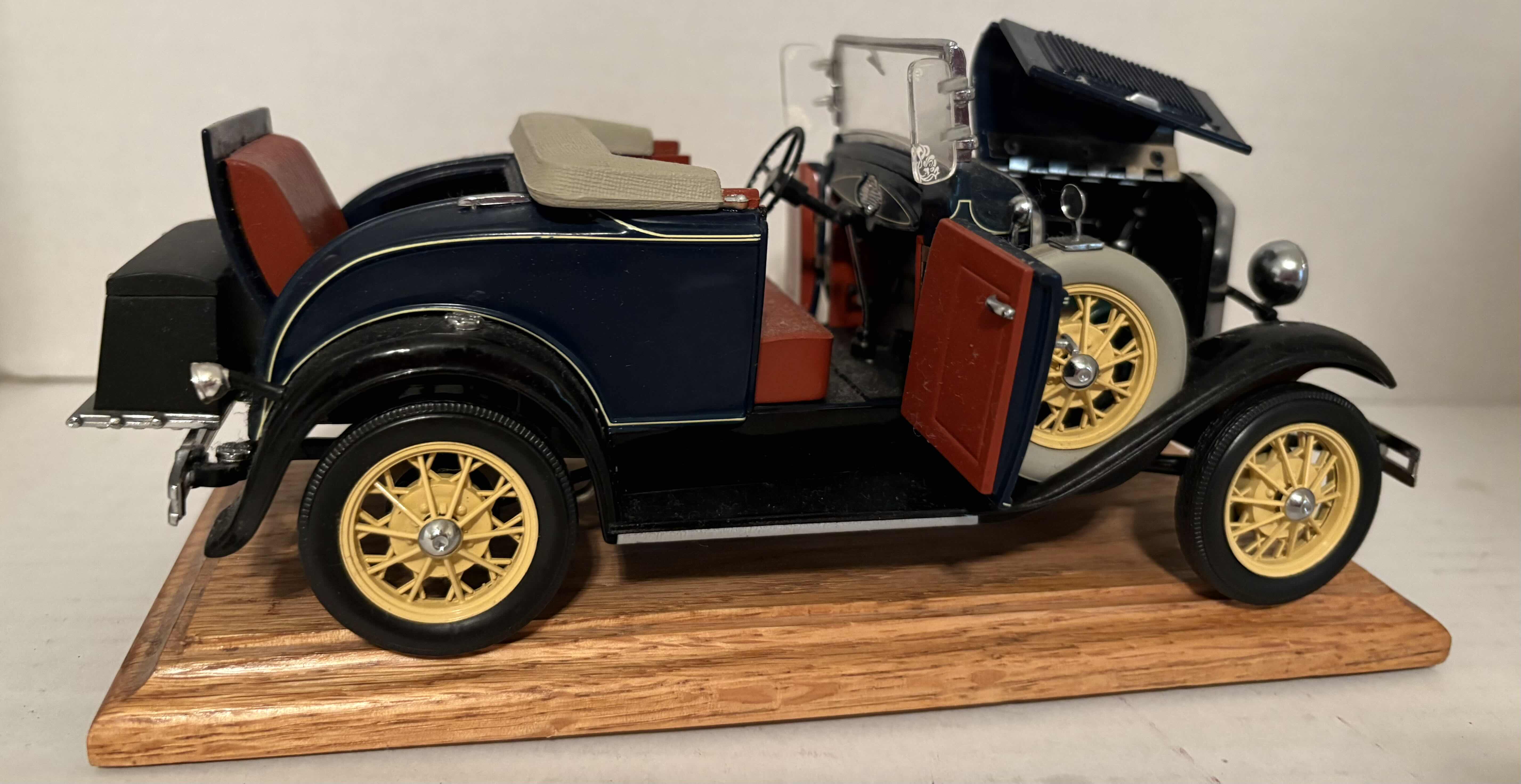 Photo 1 of 1999 MOTORCITY CLASSICS 1/18 SCALE ‘31 MODEL A CAR WITH MOVING PARTS AND WOODEN STAND