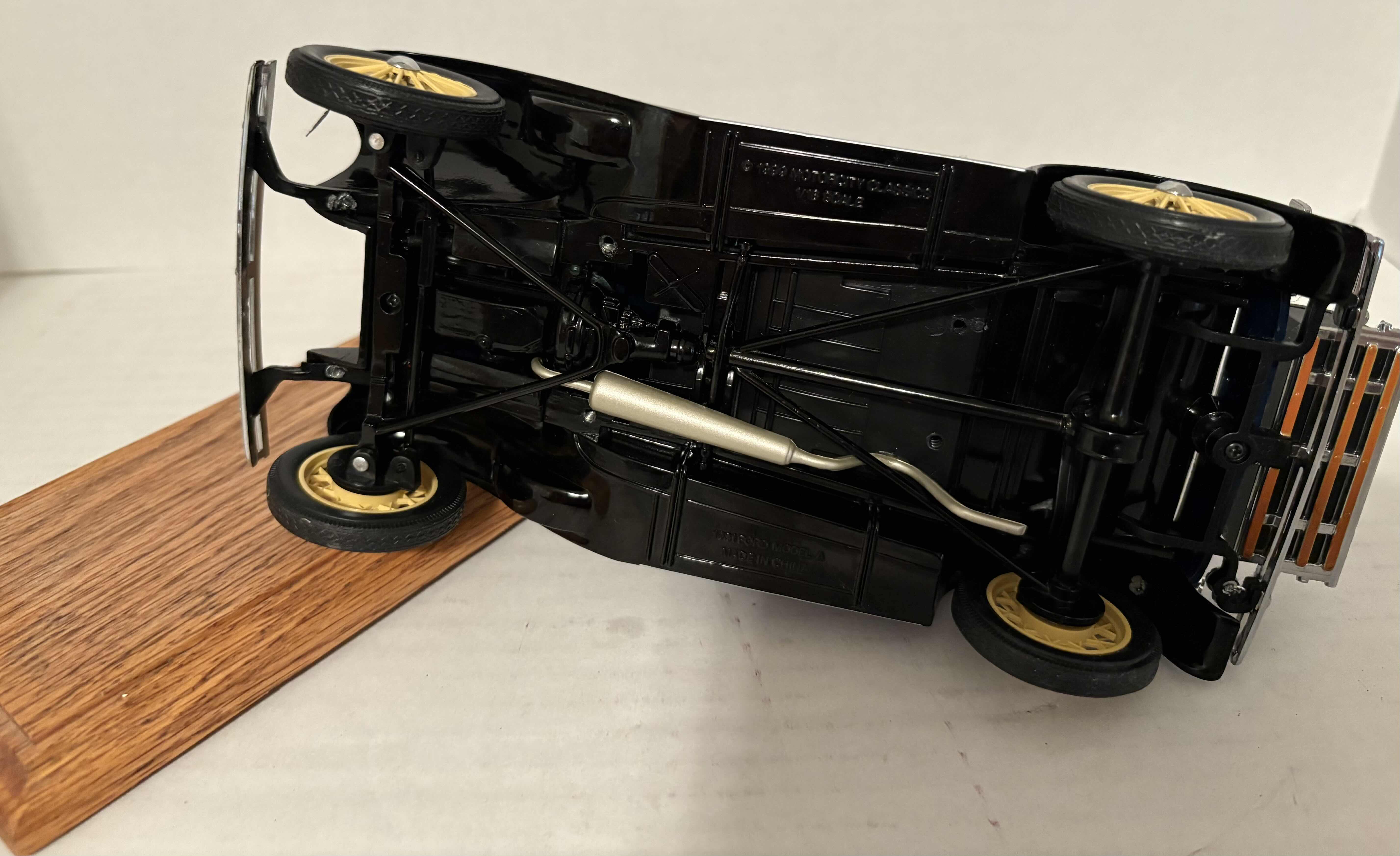 Photo 1 of 1999 MOTORCITY CLASSICS 1/18 SCALE ‘31 MODEL A CAR WITH MOVING PARTS AND WOODEN STAND