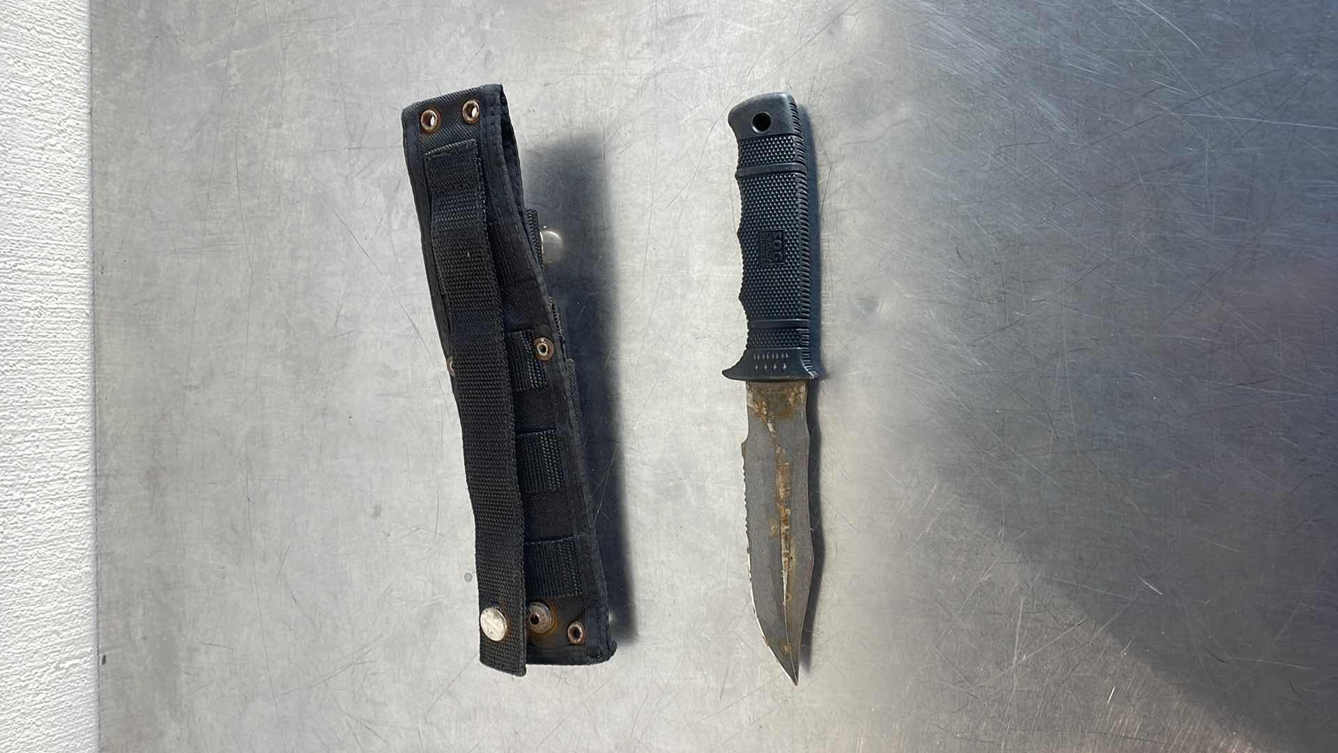 Photo 1 of SOG KNIFE NEEDS TLC AND SNAP BROKE ON HOLDER. STILL SHARP